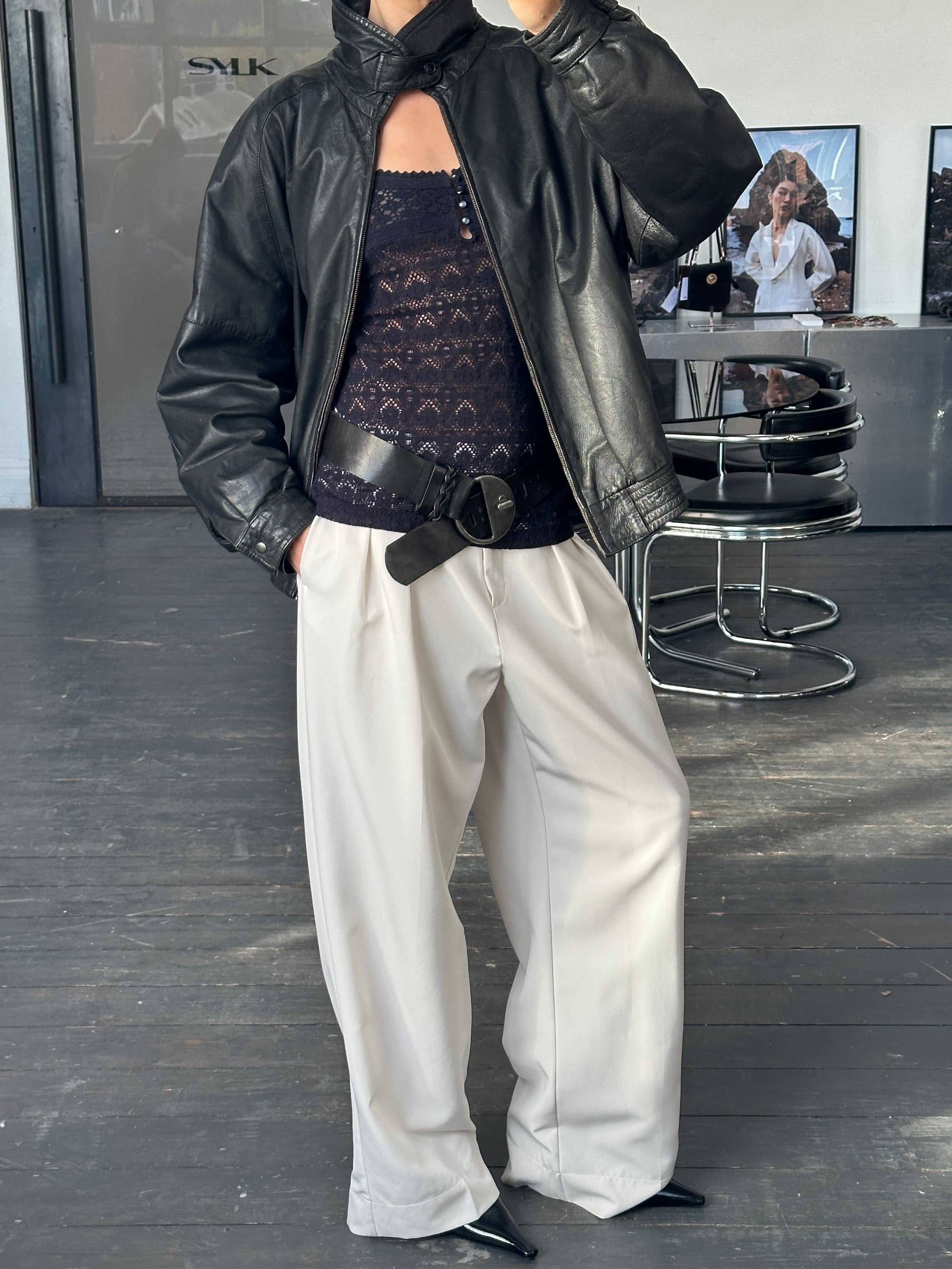 Vintage 1980s high neck leather bomber jacket, size large, styled with classic vintage leather details and a fitted silhouette.