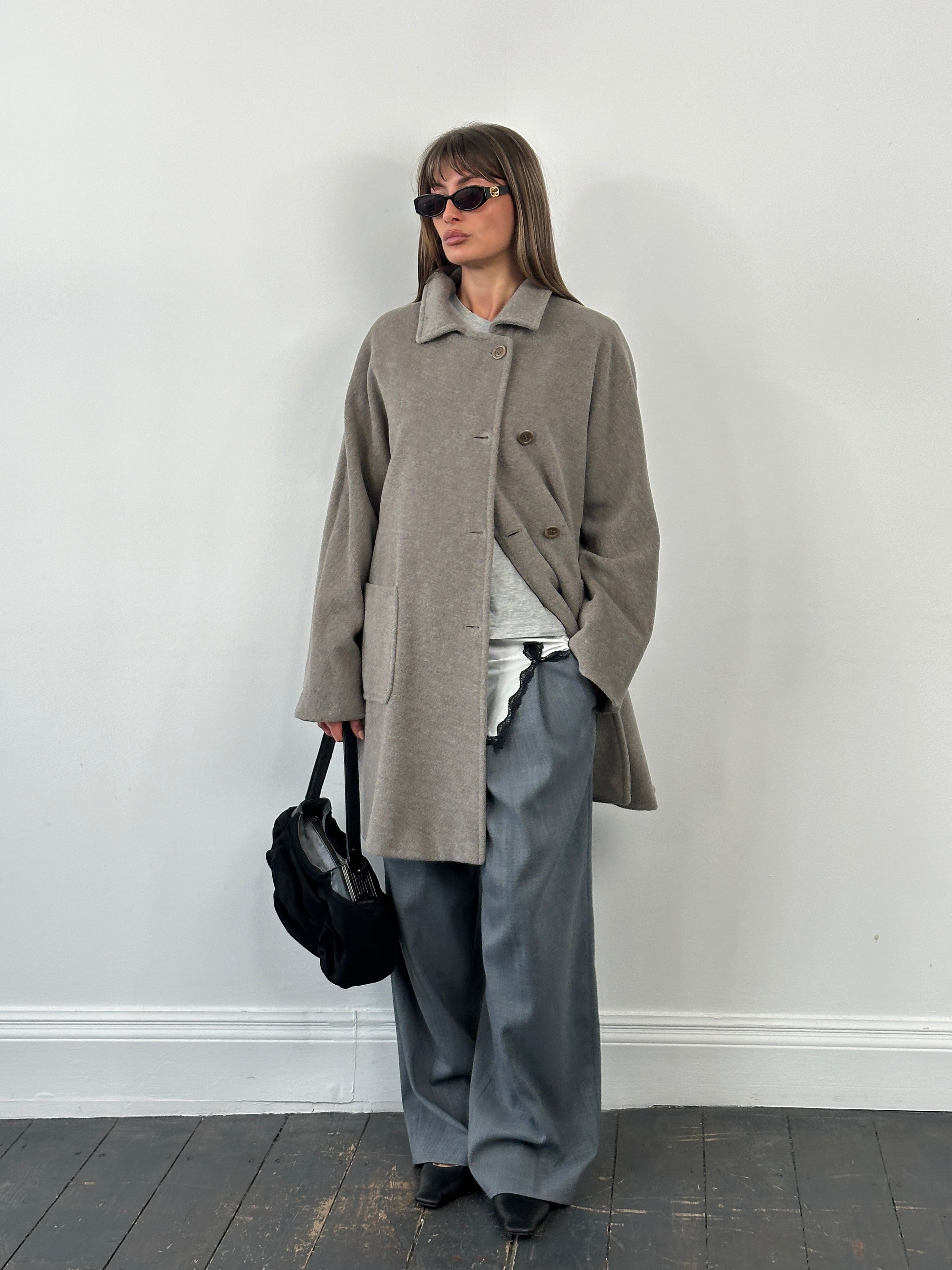 Marella 1990s virgin wool single-breasted coat in XL, with classic tailored design and neutral color, hanging on a hanger.