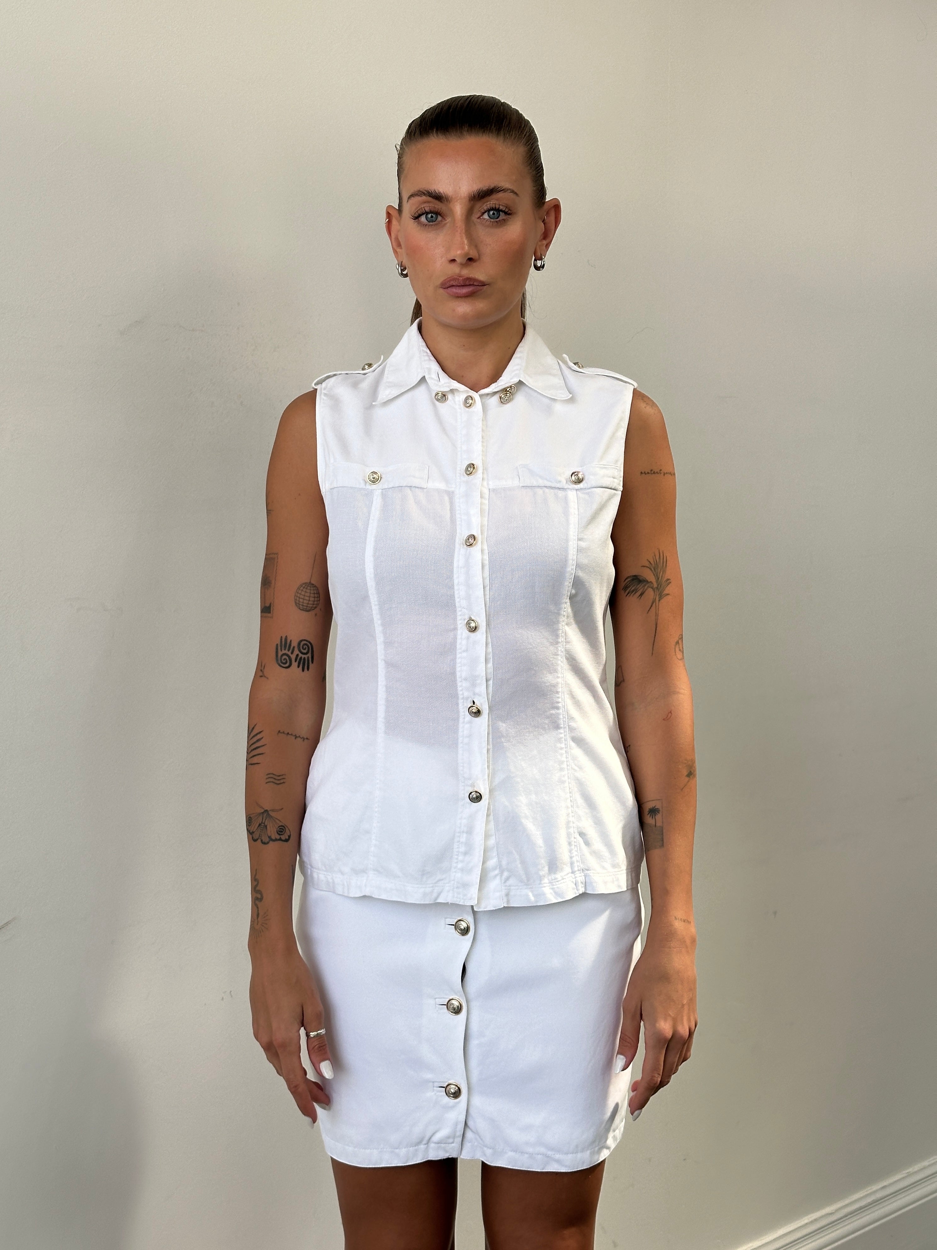Versace Versus 1990s bespoke two-piece skirt set with button details, featuring a stylish skirt in a unique design.