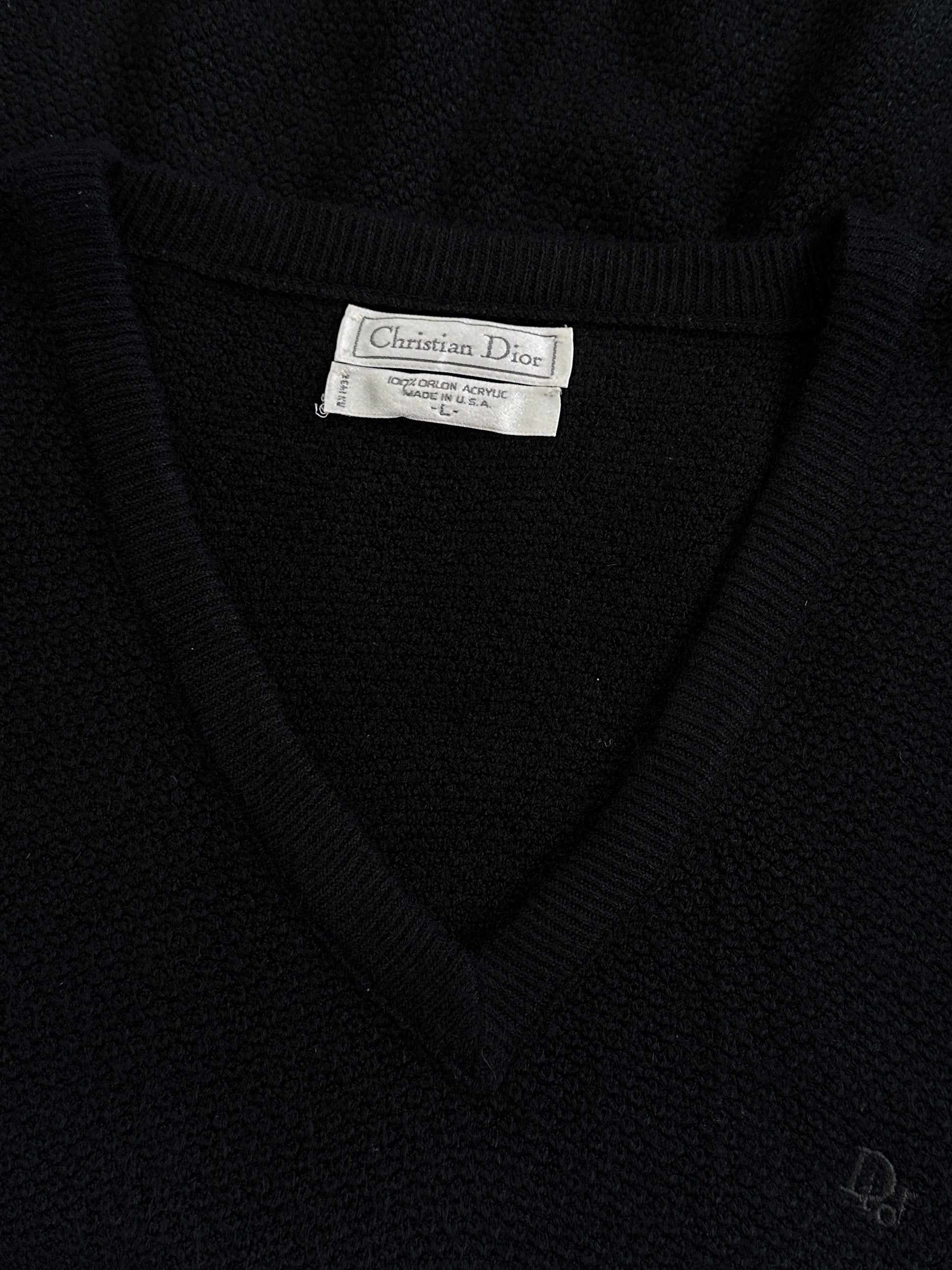 Christian Dior V-neck logo knitted jumper in size M/L, featuring the iconic Dior logo on a cozy, stylish knit sweater.