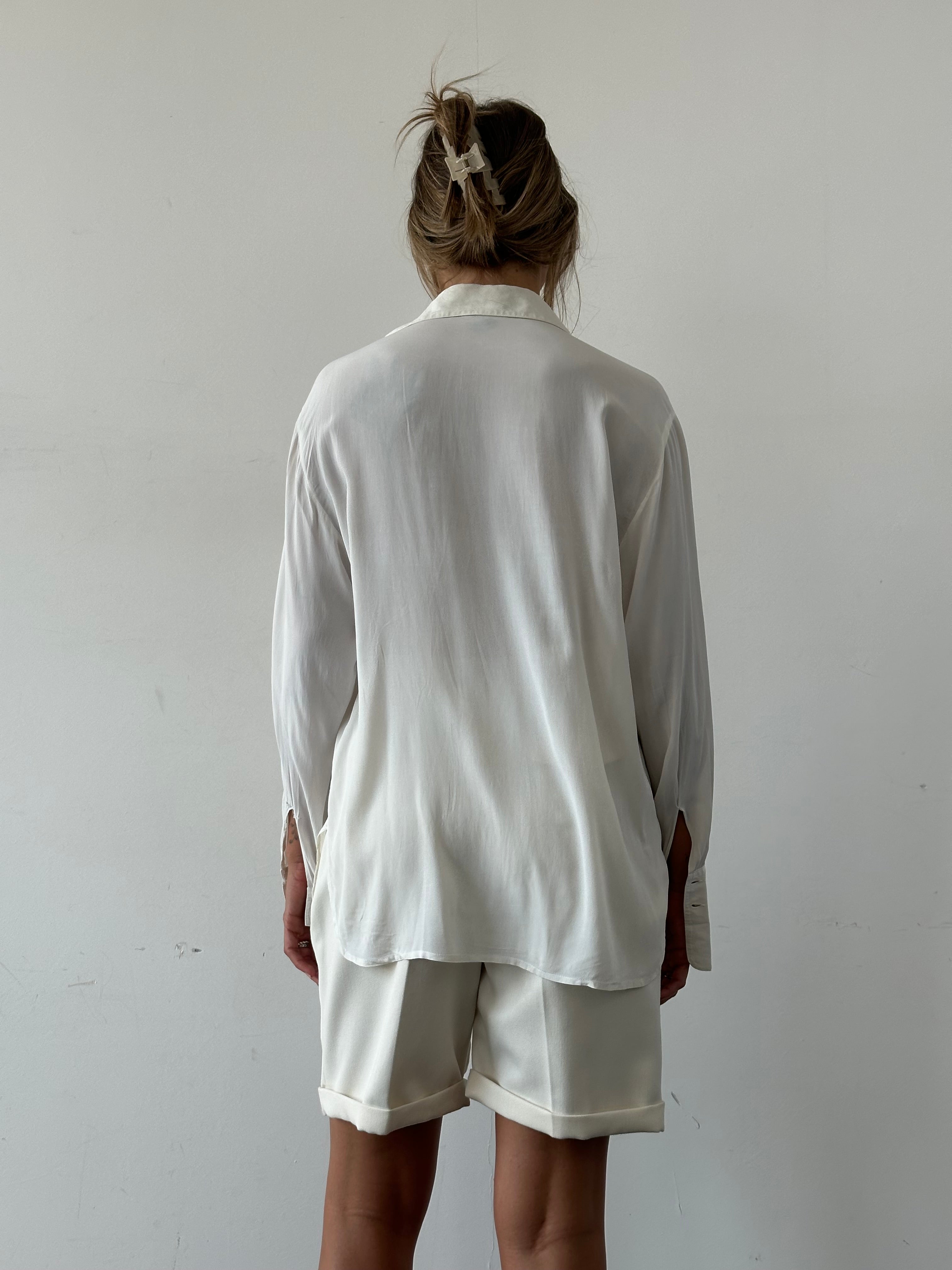 Vintage silk flowy shirt in size L, featuring a lightweight, elegant design with long sleeves and a relaxed fit.