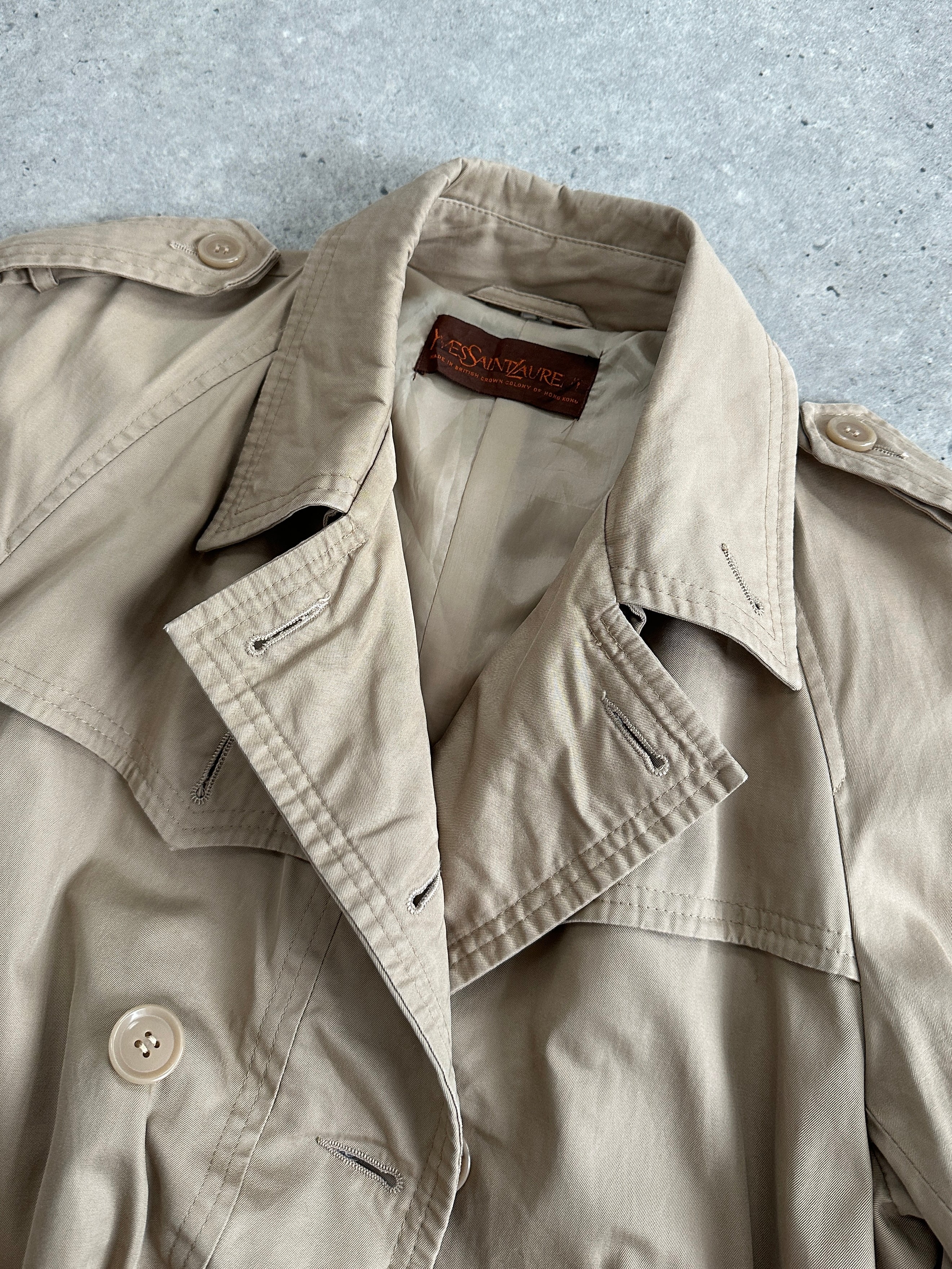 Yves Saint Laurent pure cotton double-breasted trench coat in size M, beige color, with classic lapel and belt details.