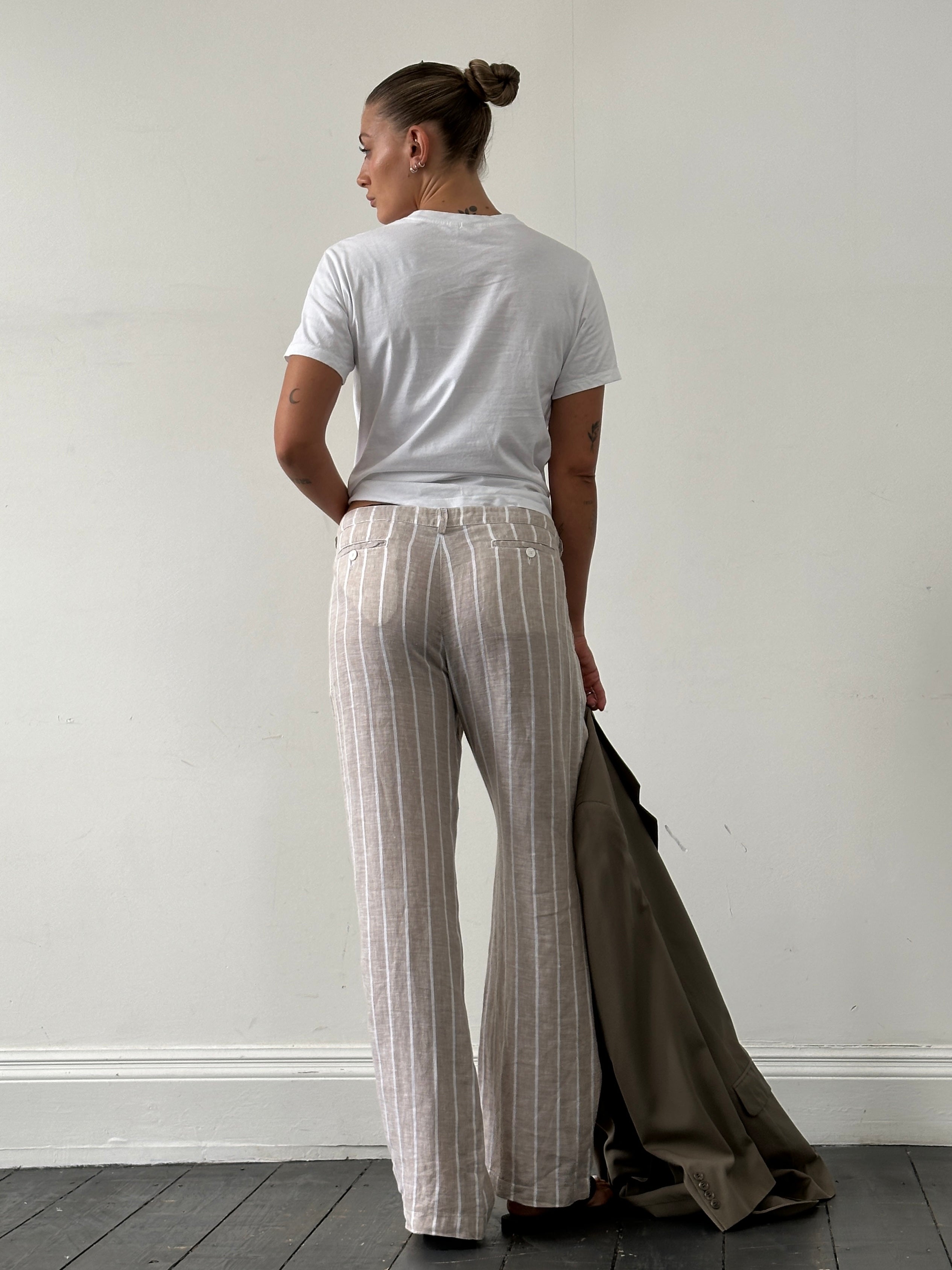 Armani Jeans pure linen wide-leg mid-rise stripe trousers in W30, showcasing stylish relaxed fit and bold stripe pattern.