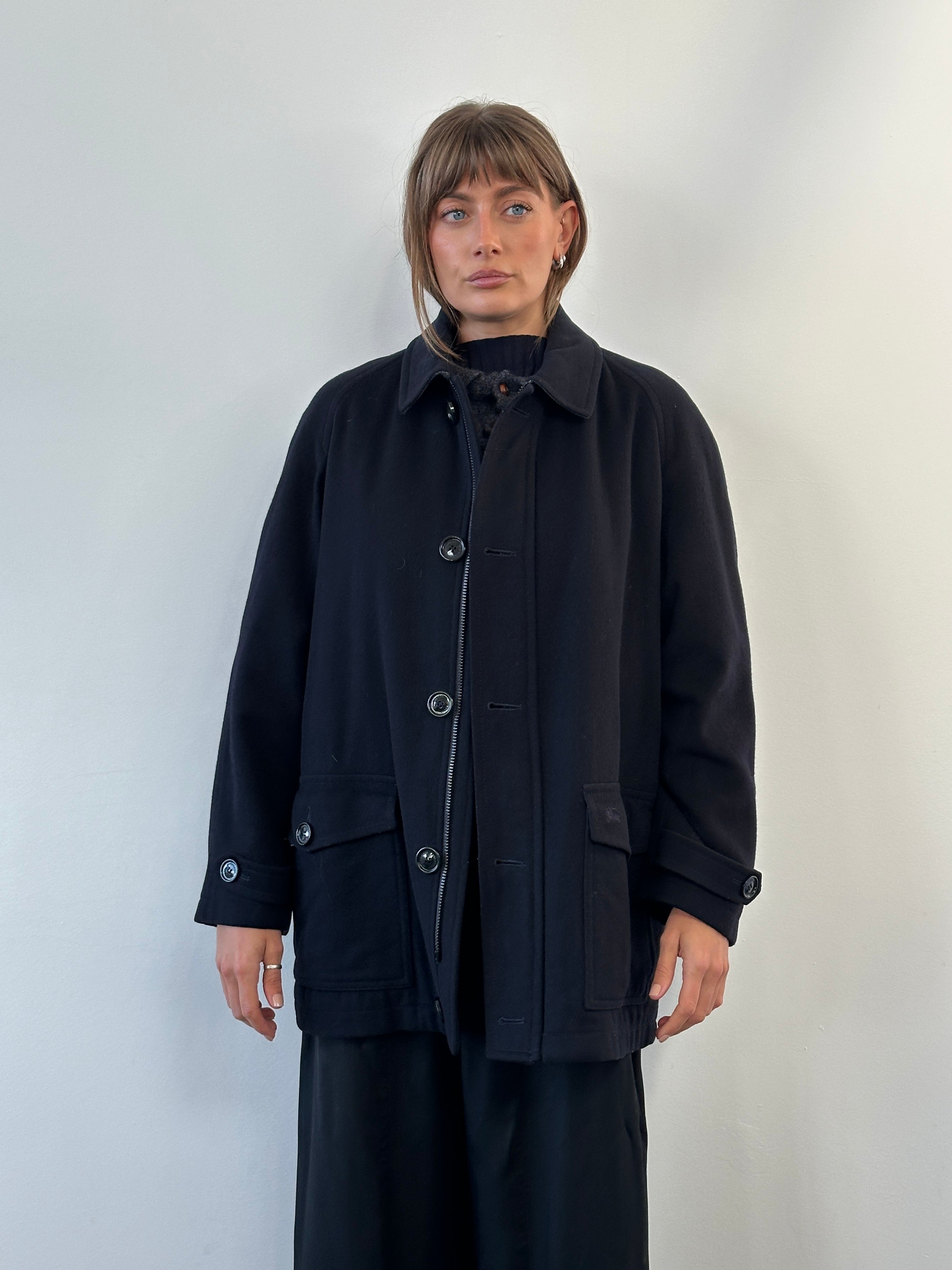 Burberry London 1990s wool single-breasted logo coat in size L/XL, featuring classic design and tailored fit.