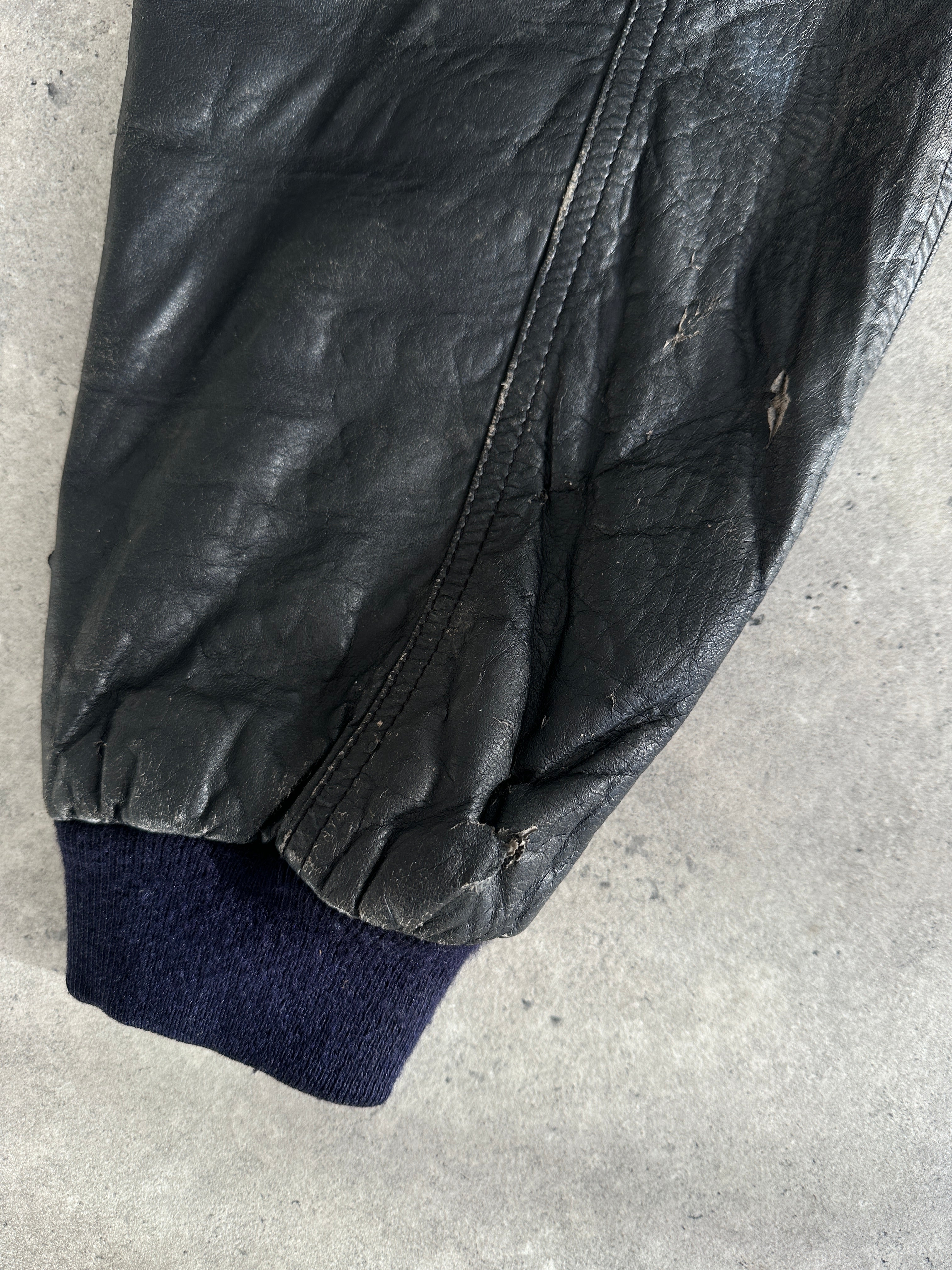 Vintage distressed leather bomber gilet jacket in M/L size, featuring rugged style and classic design details.