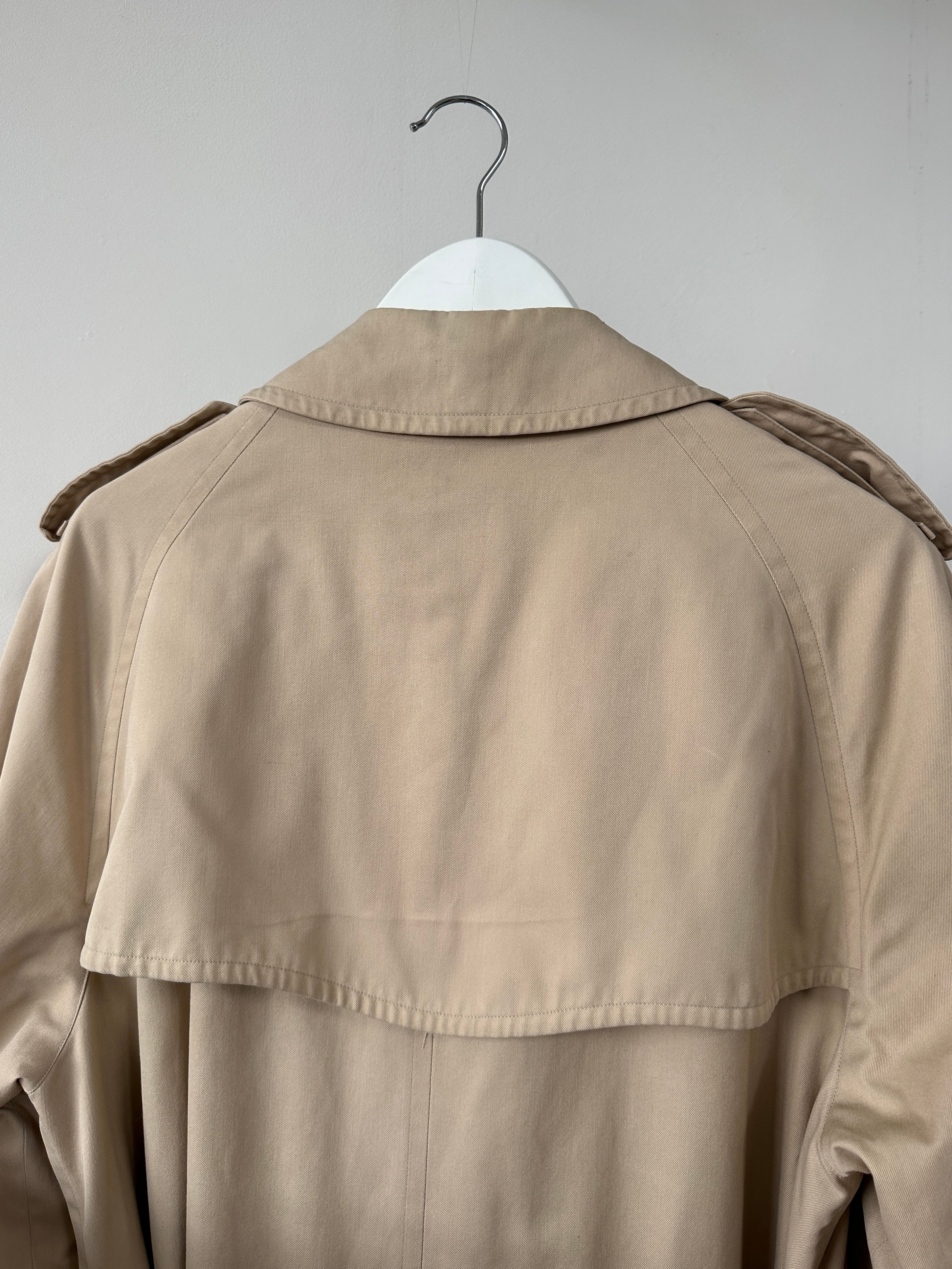 Burberry double-breasted trench coat in XL with classic beige color, featuring belt and button details, front view.