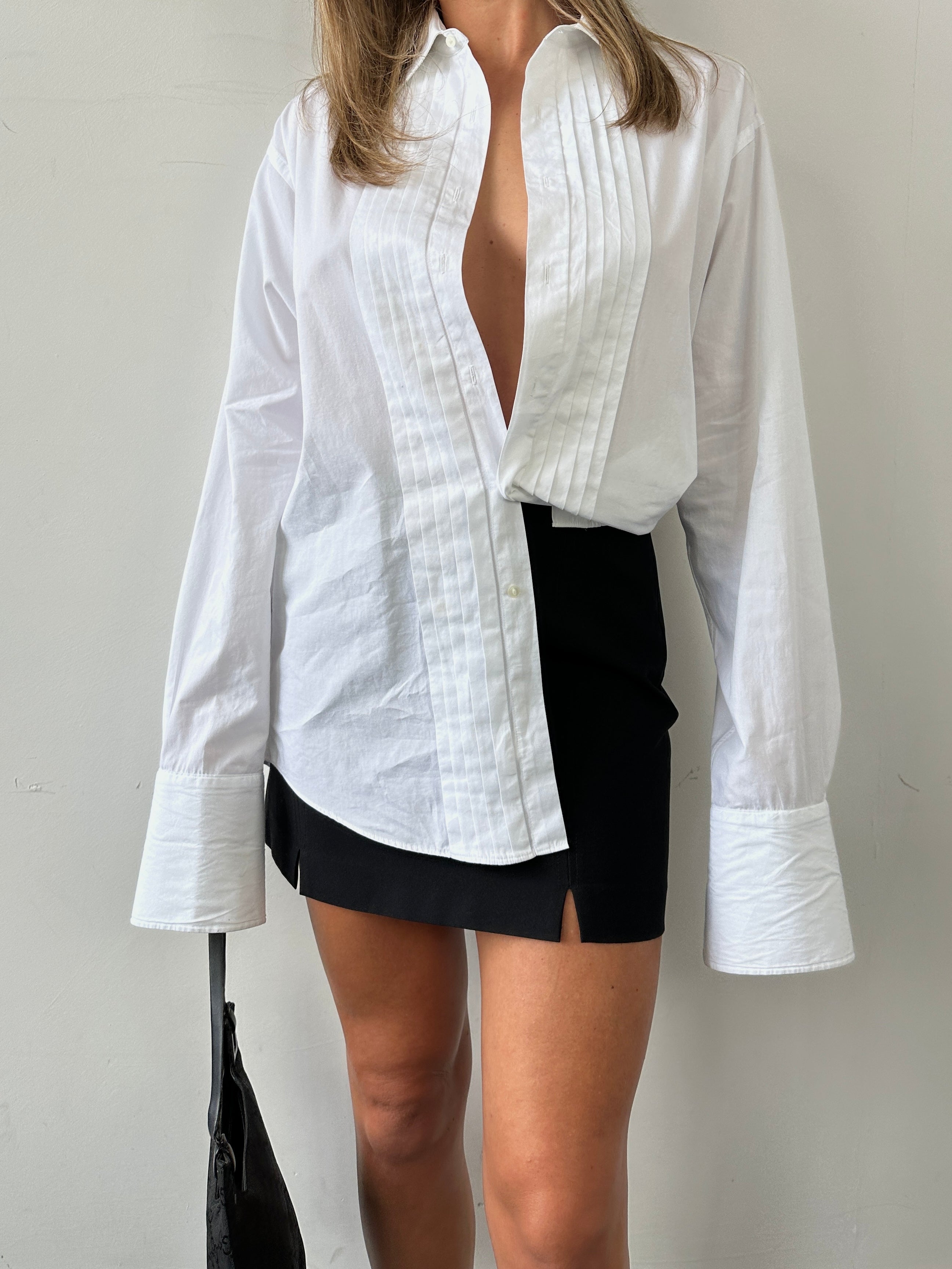 Christian Dior pleated tuxedo cotton shirt in size M, shown with crisp collar, pleats, and tailored fit details.