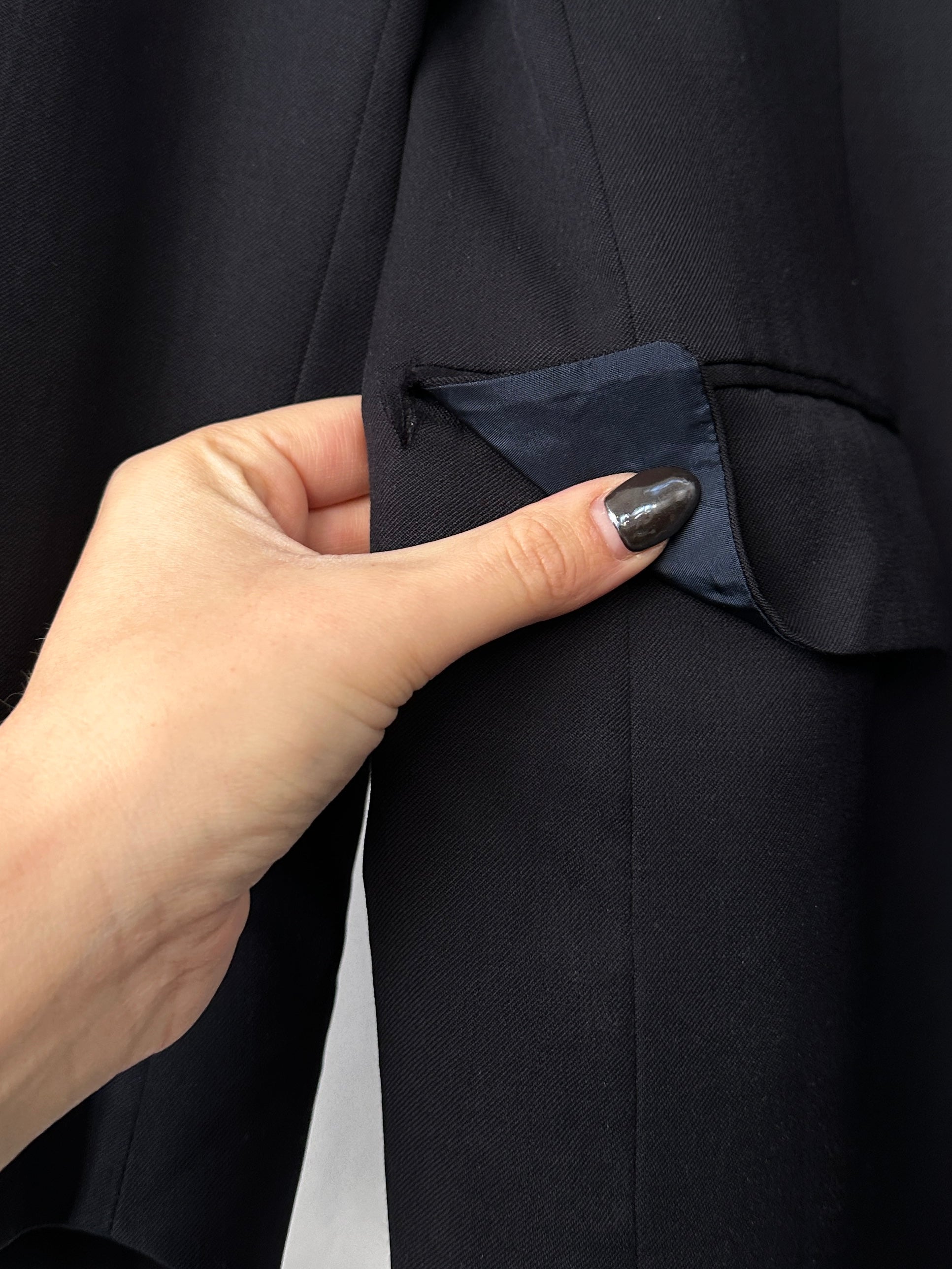 Yves Saint Laurent pure wool single-breasted blazer in M/L size, tailored fit, black color, lapel collar, and front button closure.