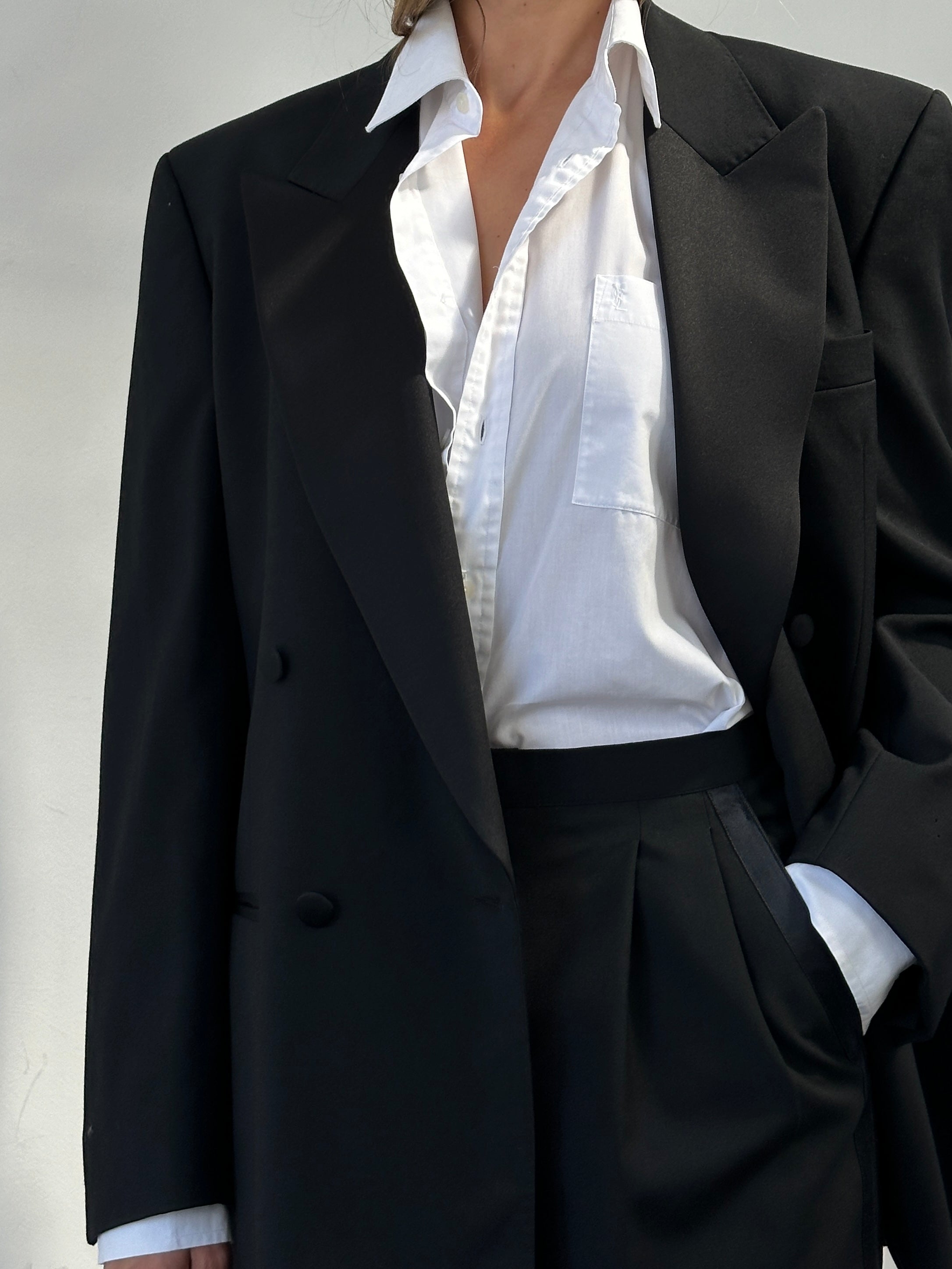 Jaeger men's black double-breasted wool tuxedo suit in size 42R/W28, tailored fit with classic lapels and stylish details.