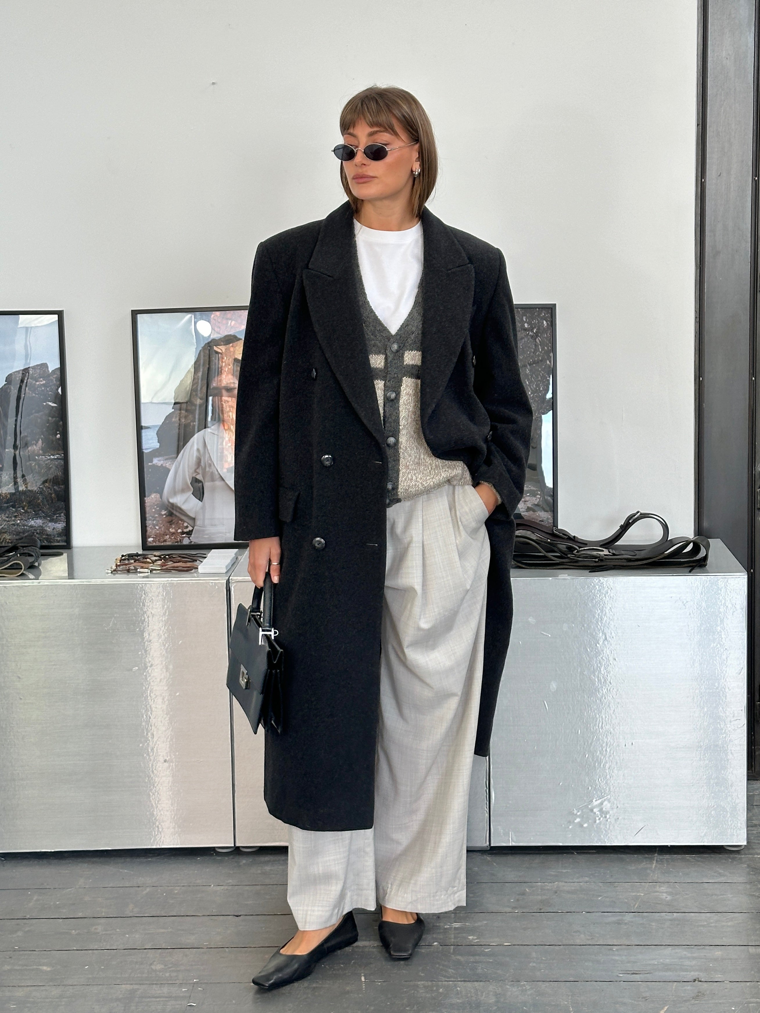 Vintage Italian 1980s double-breasted wool coat in XL, classic design with wide lapels and textured fabric, front view.