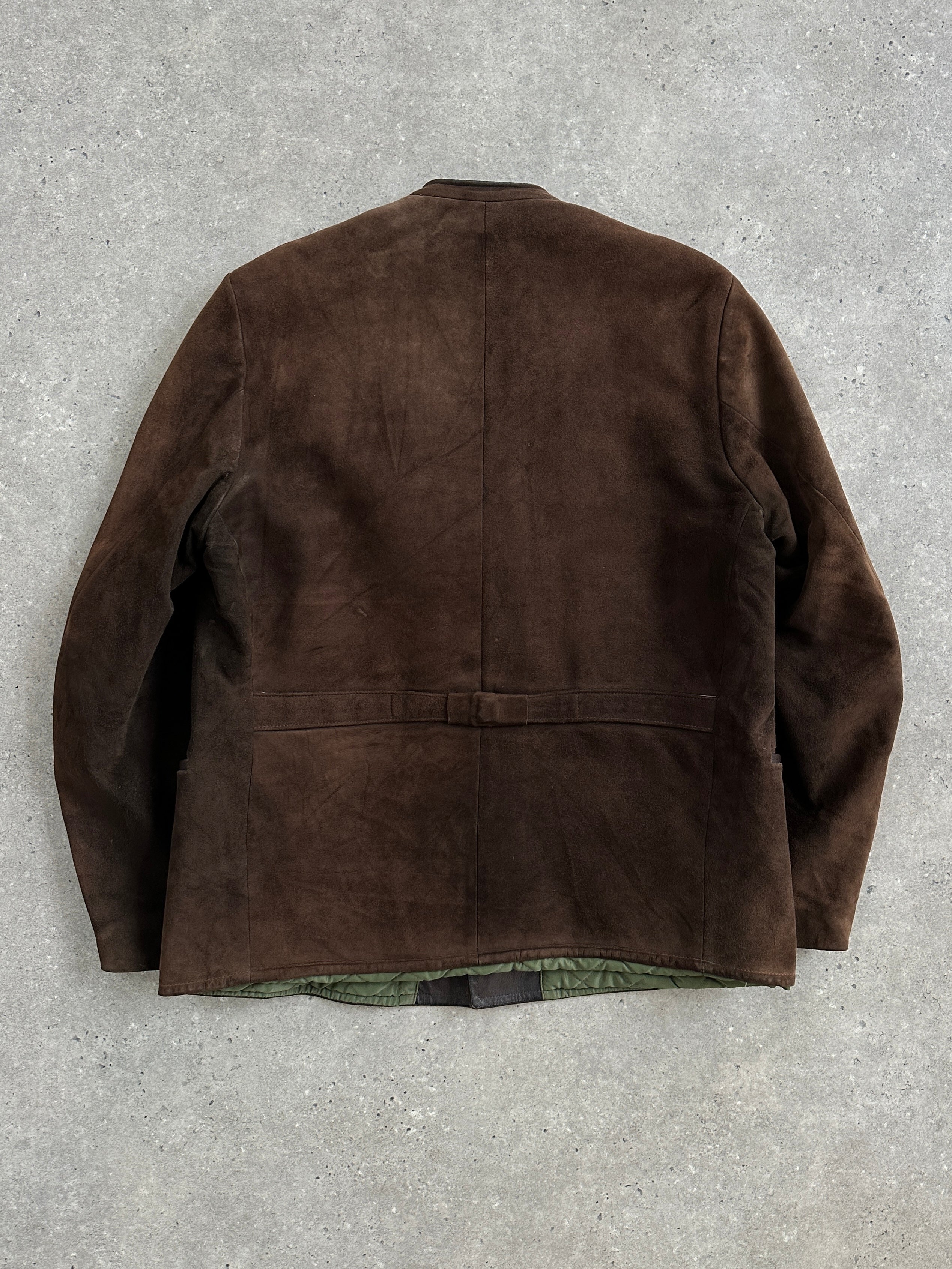 Vintage 1970s XL suede leather jacket displayed on a hanger, showcasing classic style and rich texture of the vintage leather material.