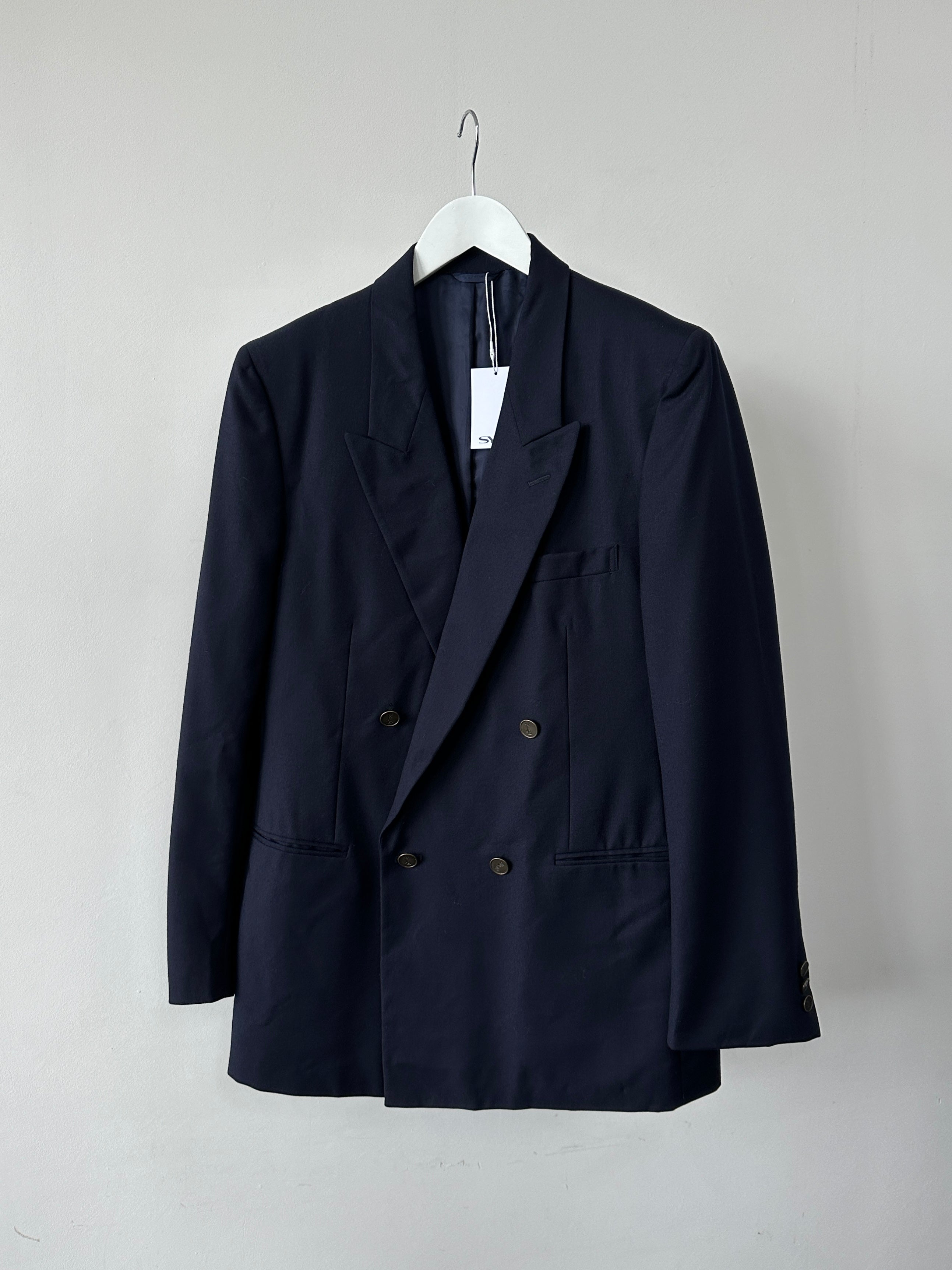 Yves Saint Laurent double-breasted pure wool blazer in size 42R/L-XL, featuring a tailored fit and classic design in dark color.