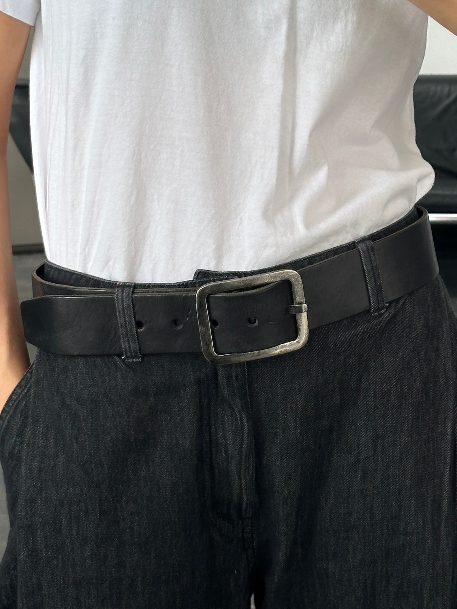 Vintage 1990s chrome rectangle buckle leather belt showing the classic buckle detail and worn leather strap, size W35-39.