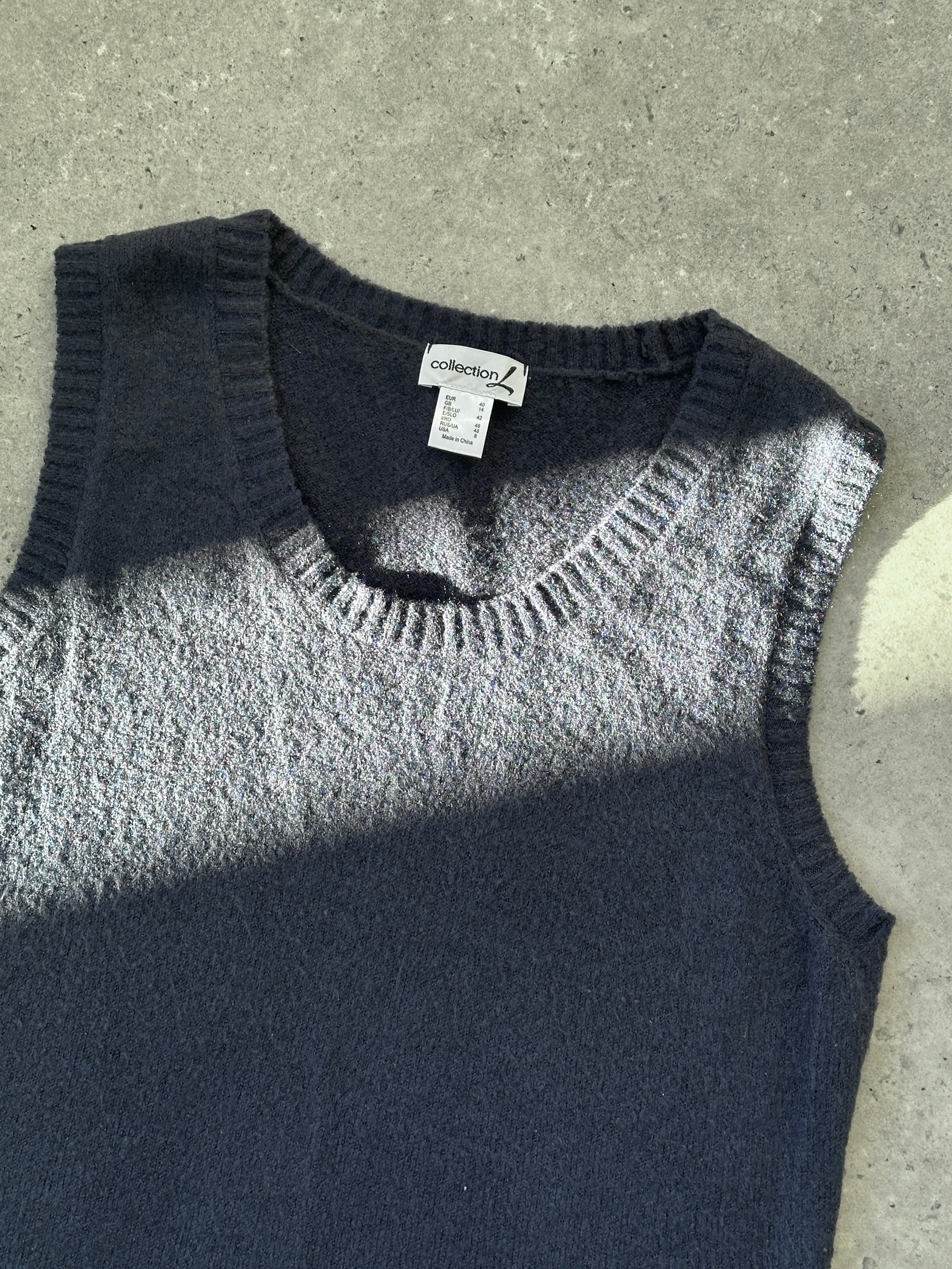 Vintage brand vintage knit sleeveless vest in size L, featuring a classic design and textured fabric.
