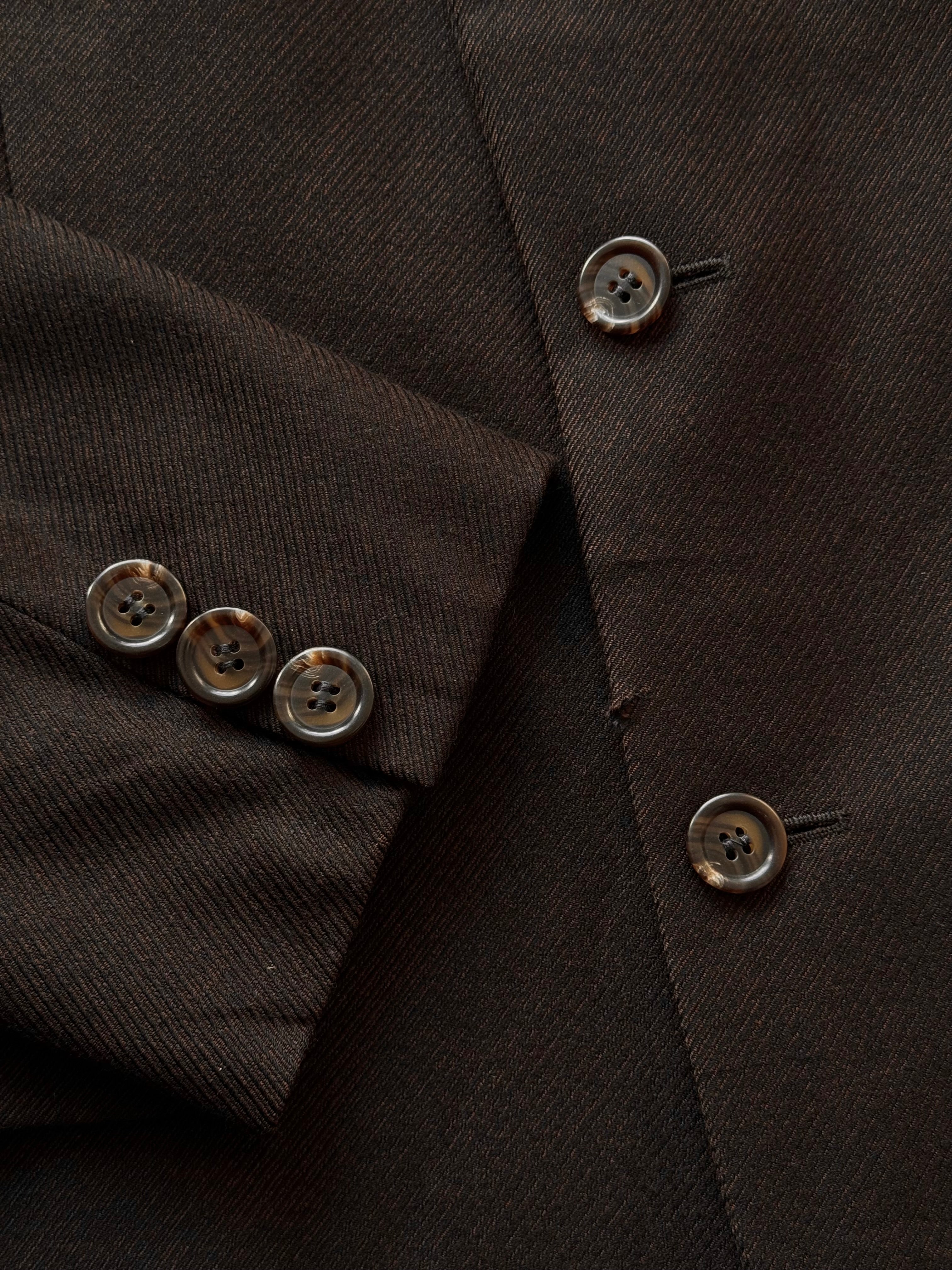 Yves Saint Laurent men's 1990s pure wool single-breasted blazer in size 38R/M, shown in classic dark color.
