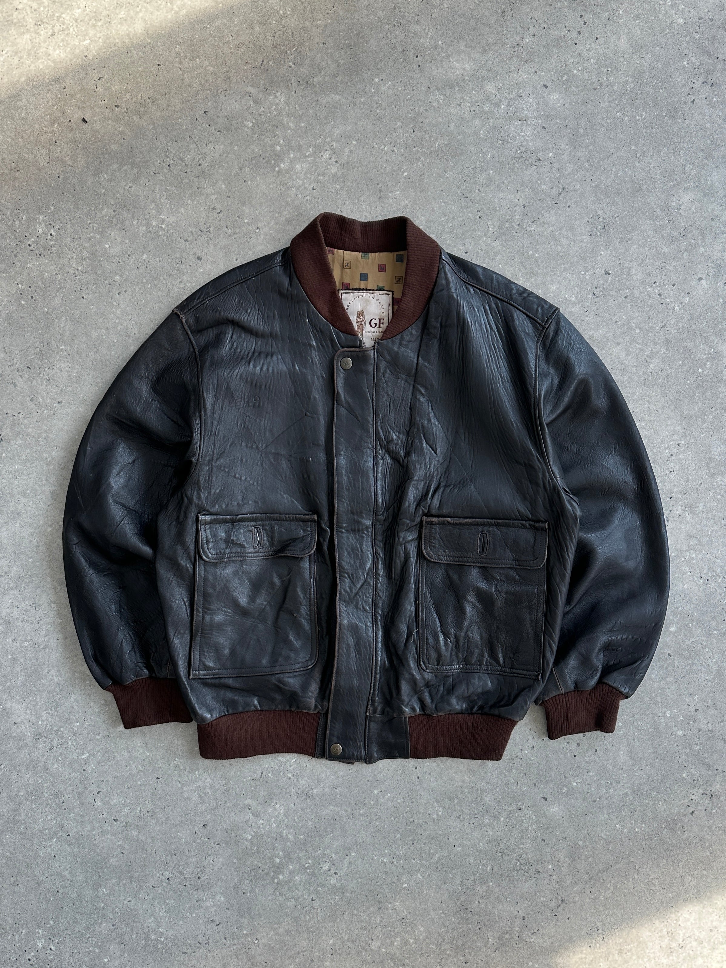Vintage Italian vintage aged leather bomber jacket in XL, featuring distressed leather and classic bomber design.