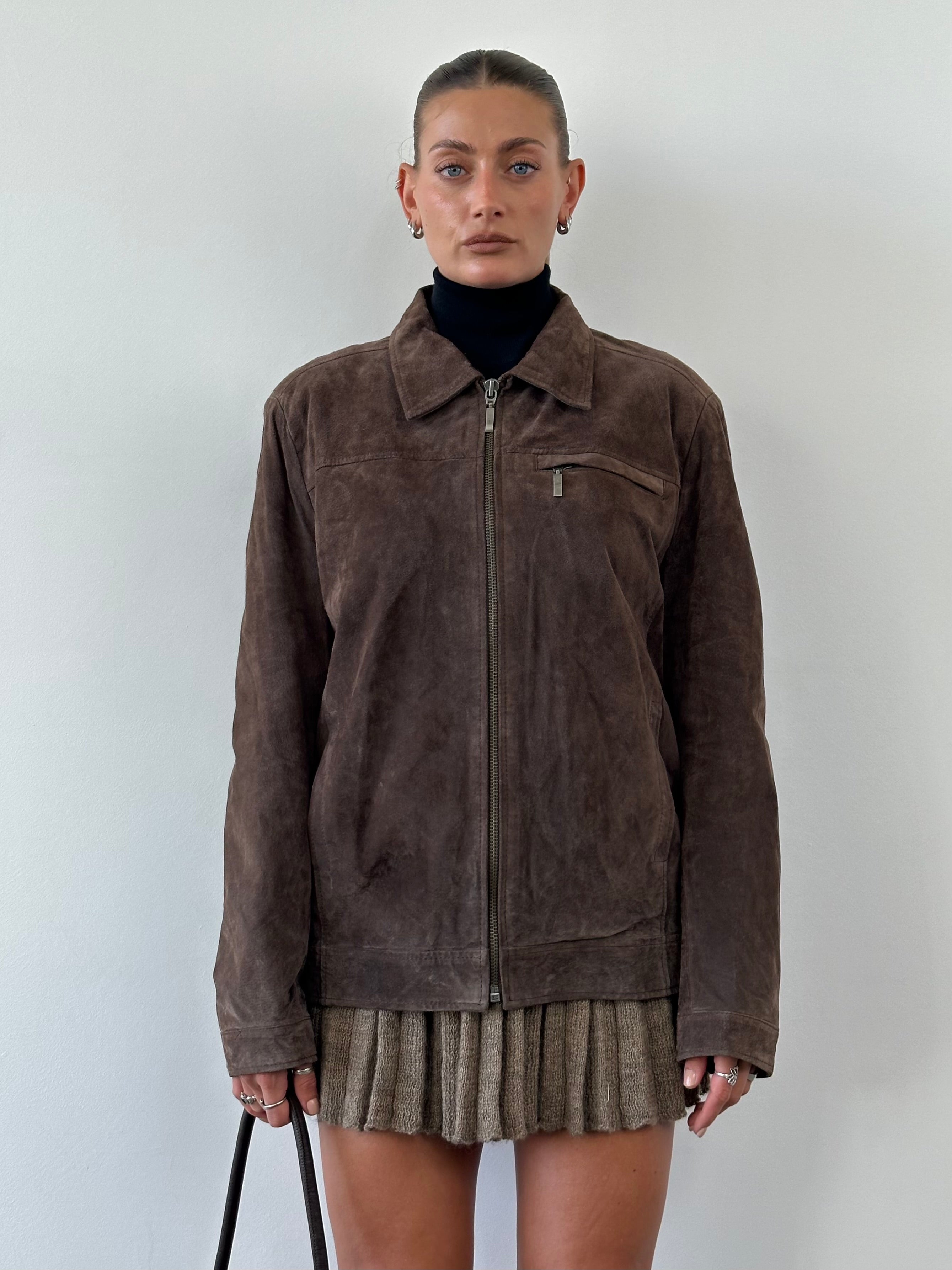 Vintage suede zip-up jacket in size L, featuring a classic design with a front zipper and soft suede material.