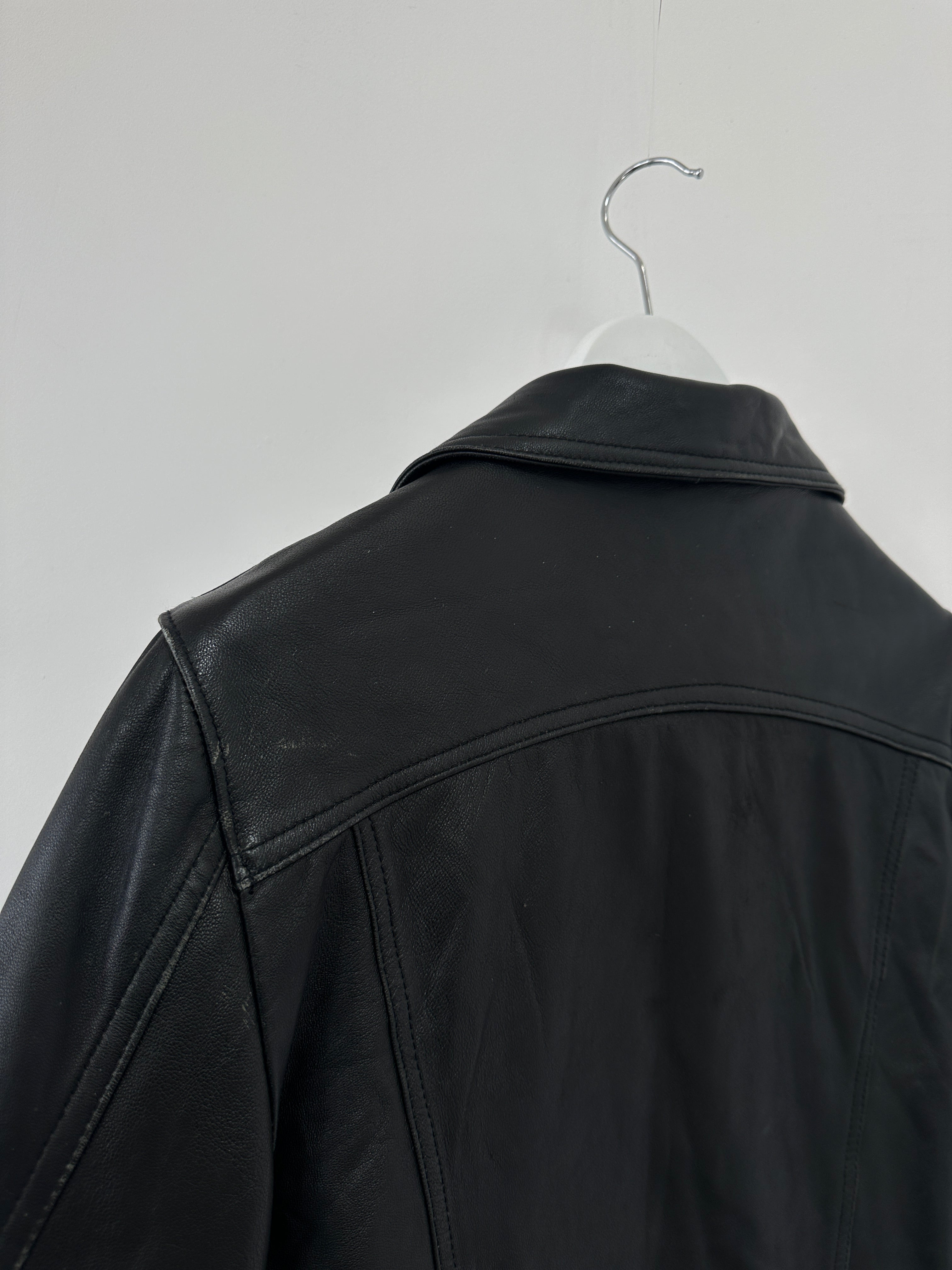 Italian vintage leather jacket with button-up front, in S/M size, featuring classic distressed leather and timeless style.