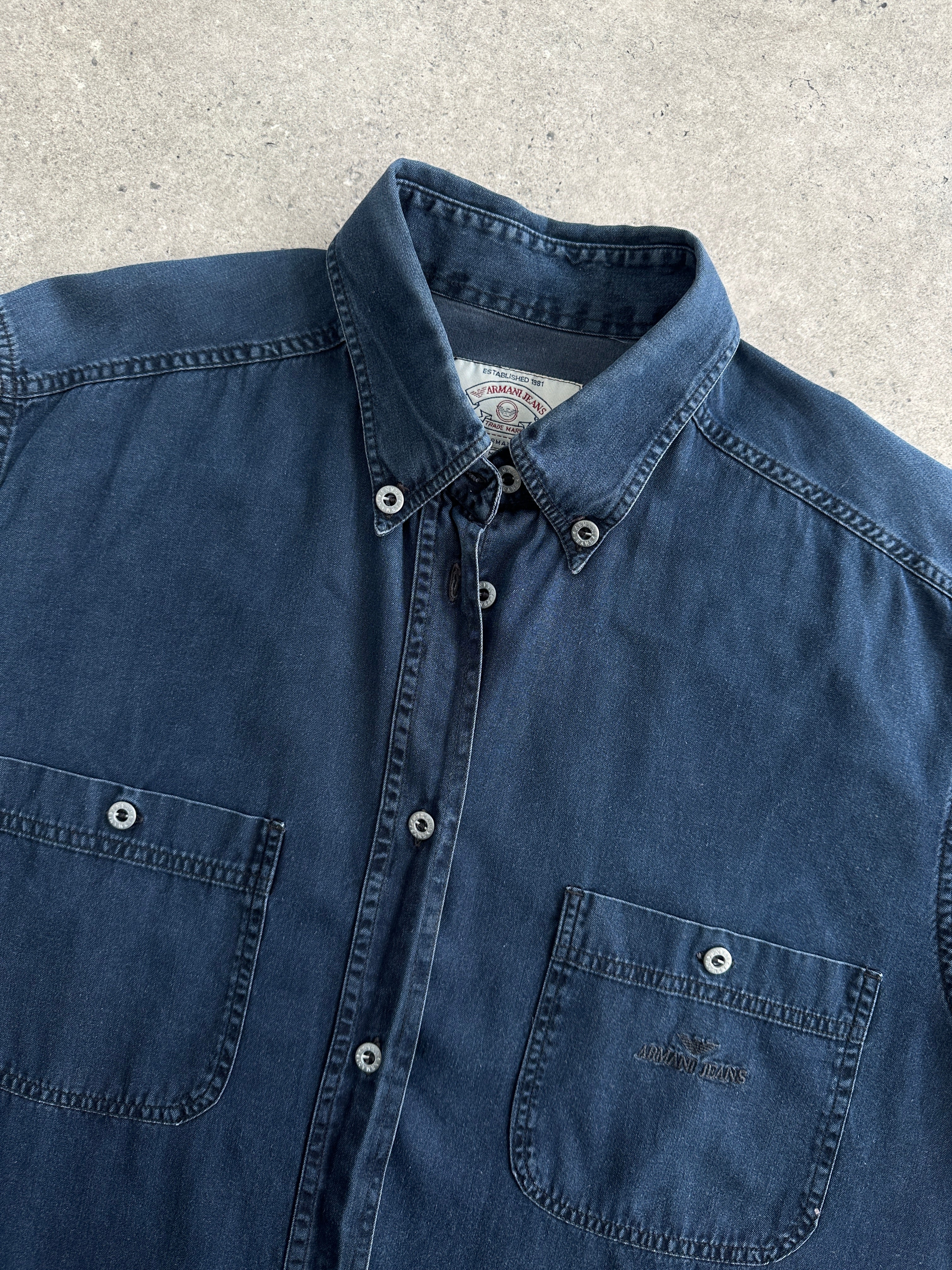 Armani Jeans denim logo shirt in size L, featuring a casual blue denim fabric with embroidered Armani logo.