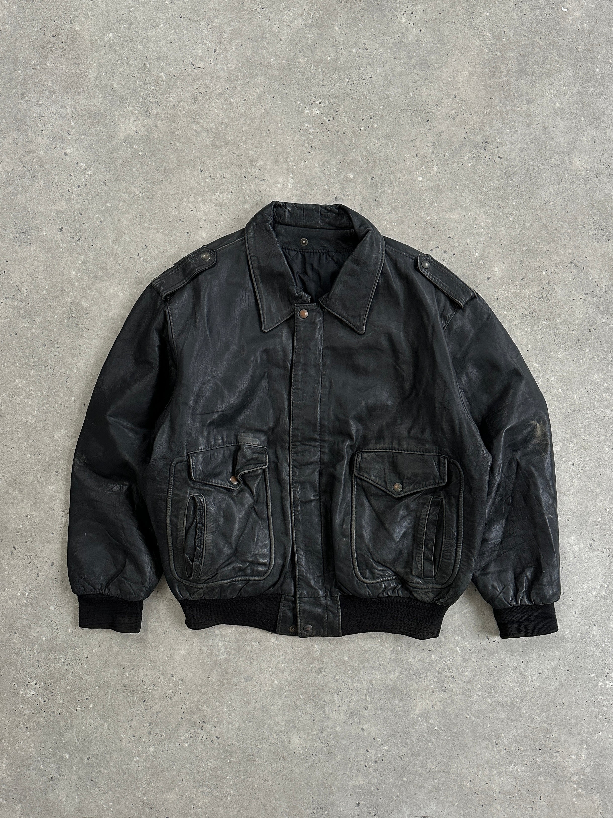 Vintage distressed leather bomber jacket in XL size, featuring a classic design with a worn, vintage look.