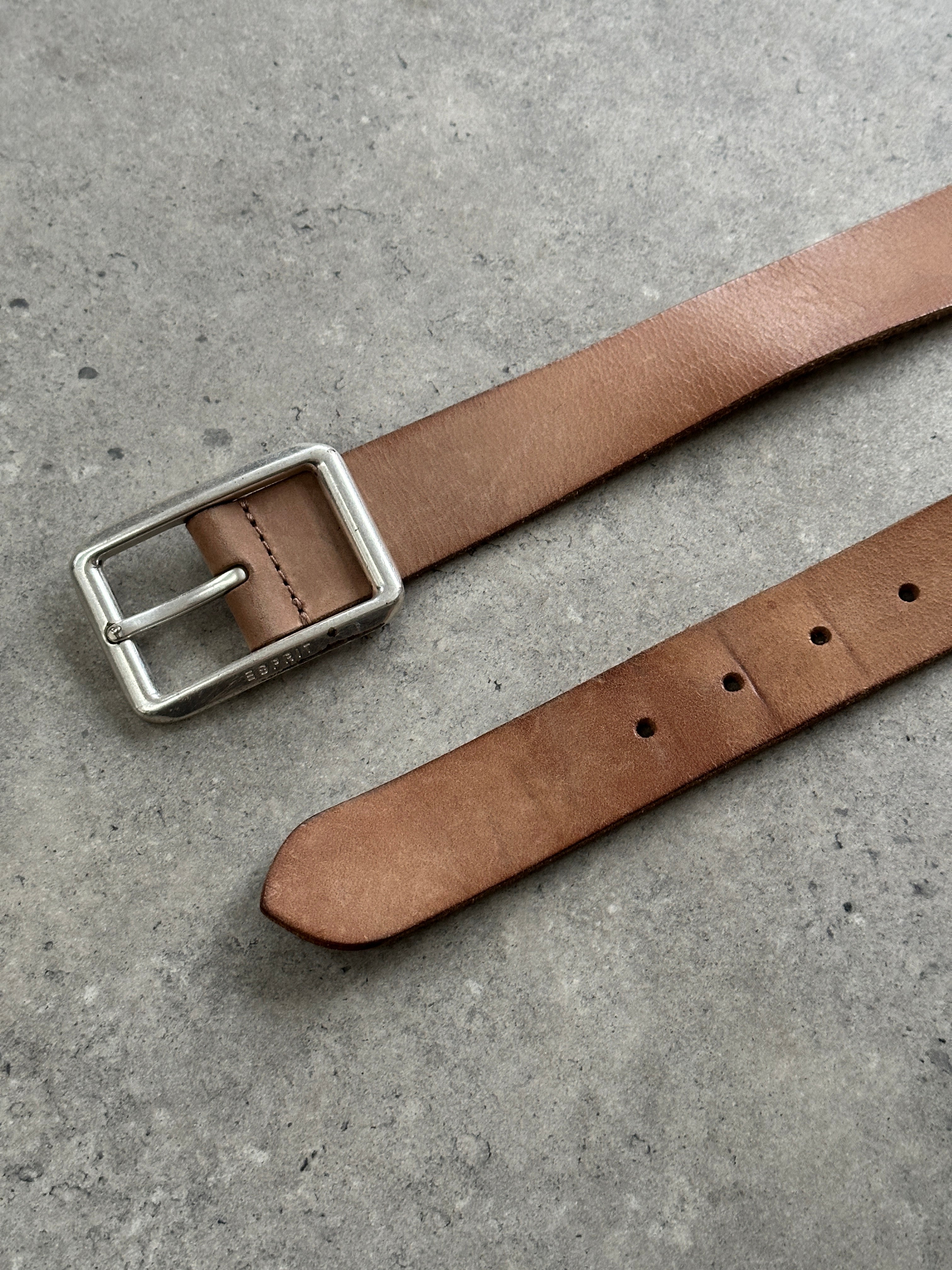 Vintage leather belt in W32-35 with a classic buckle, showcasing aged brown leather and detailed craftsmanship.