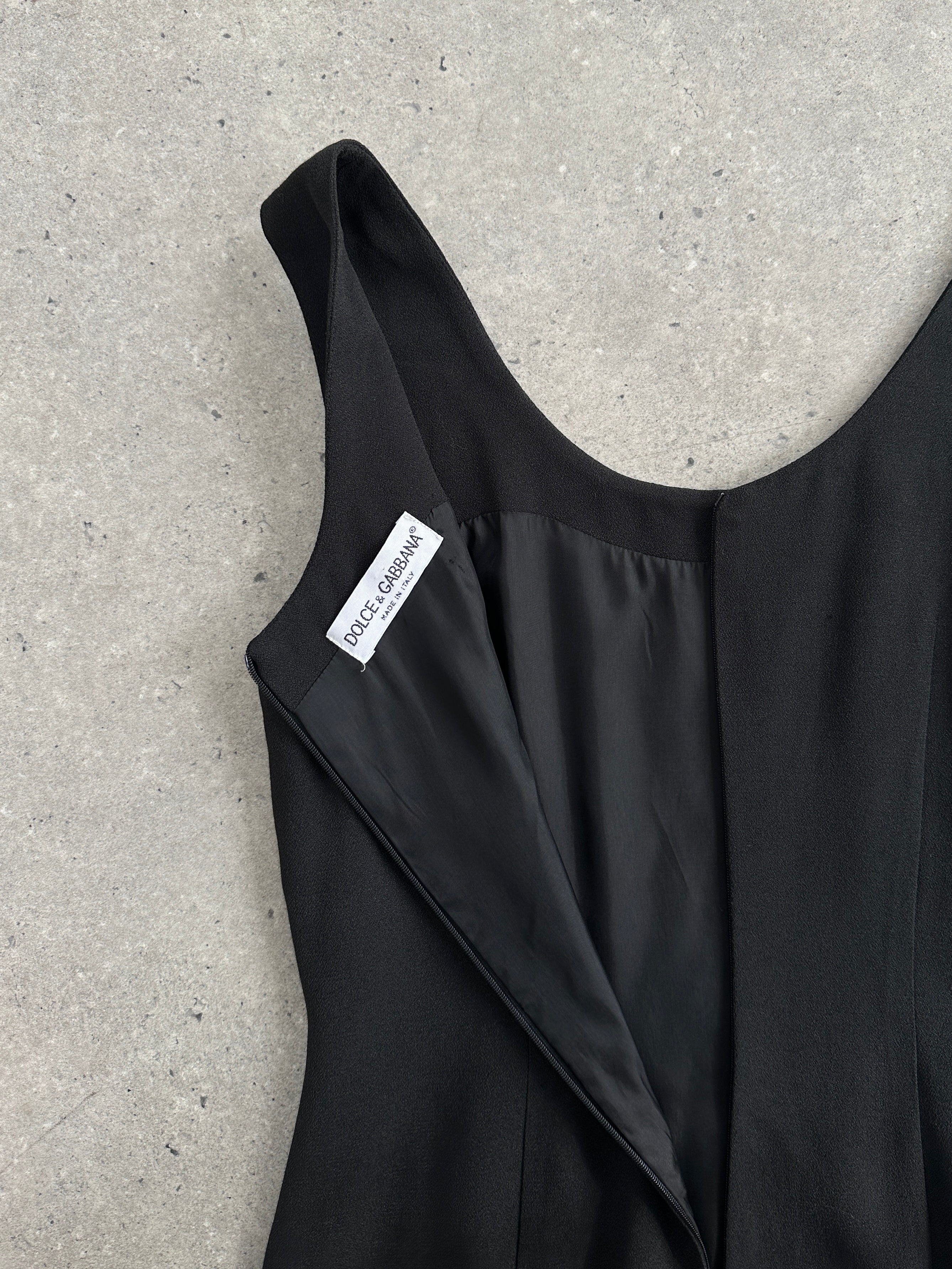 Dolce & Gabbana fitted mini dress in vibrant fabric, showcasing a sleek silhouette and stylish design.