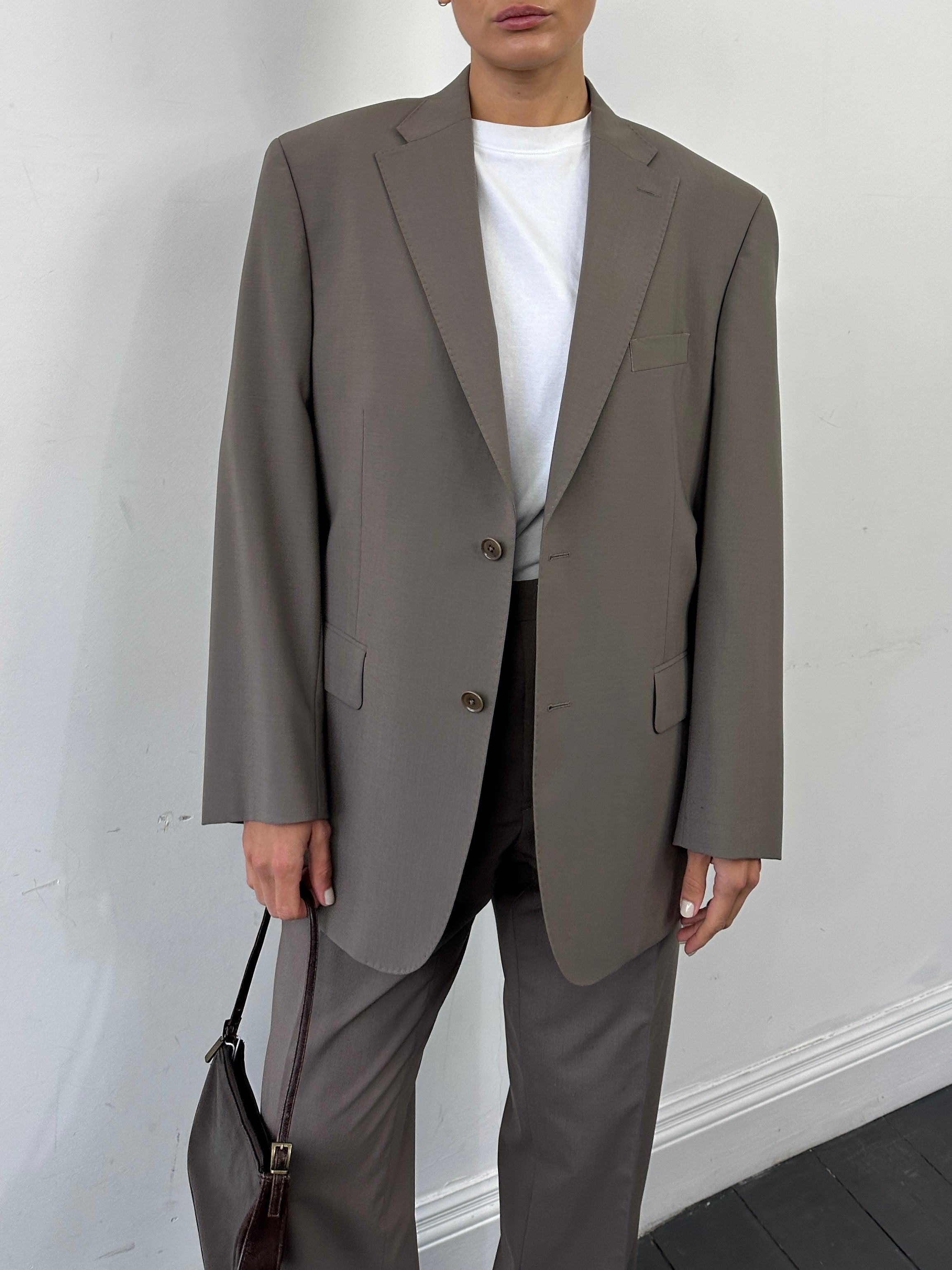 Vintage wool vintage jumpsuit with single-breasted design in size 42S/W34, featuring classic tailored details and a timeless style.
