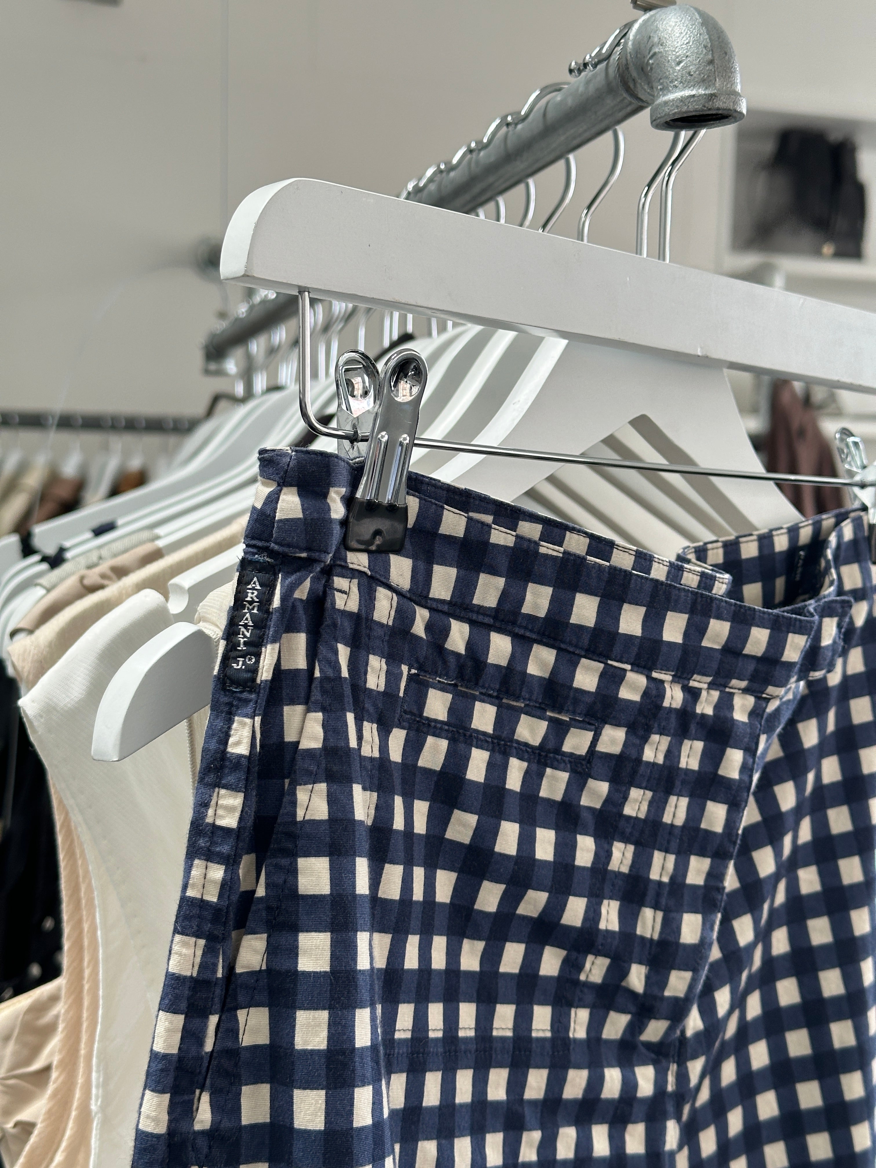 Armani Jeans two-piece set in UK8/10, featuring a stylish coordinated top and bottom, displayed on a hanger against a neutral background.