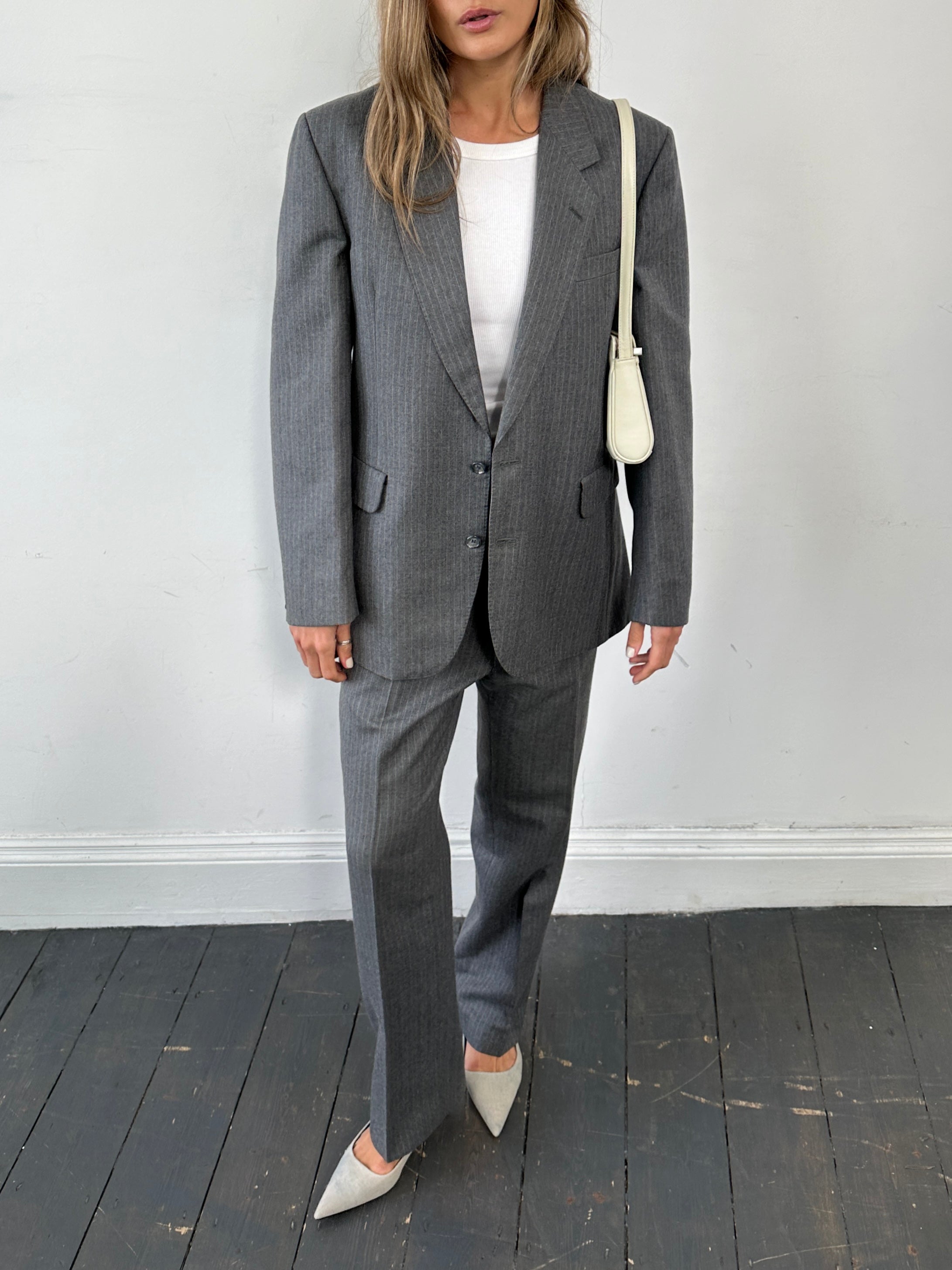 Vintage British pinstripe wool jumpsuit, single-breasted suit in size 42R/W32, with tailored lapels and classic vintage style.