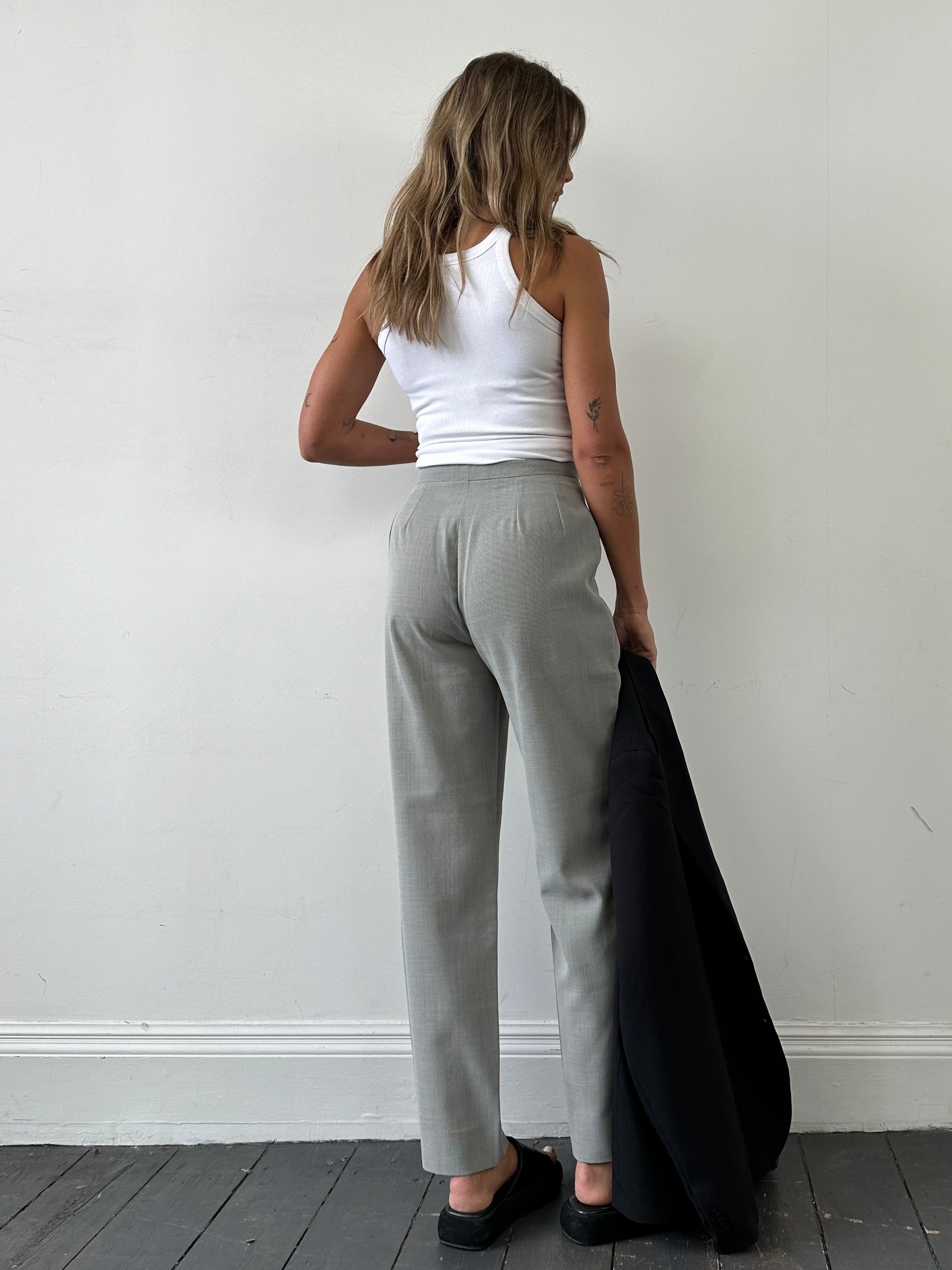 Marella wool blend high waisted tapered leg trousers in size W28, shown on a mannequin, in neutral fabric with a tailored fit.