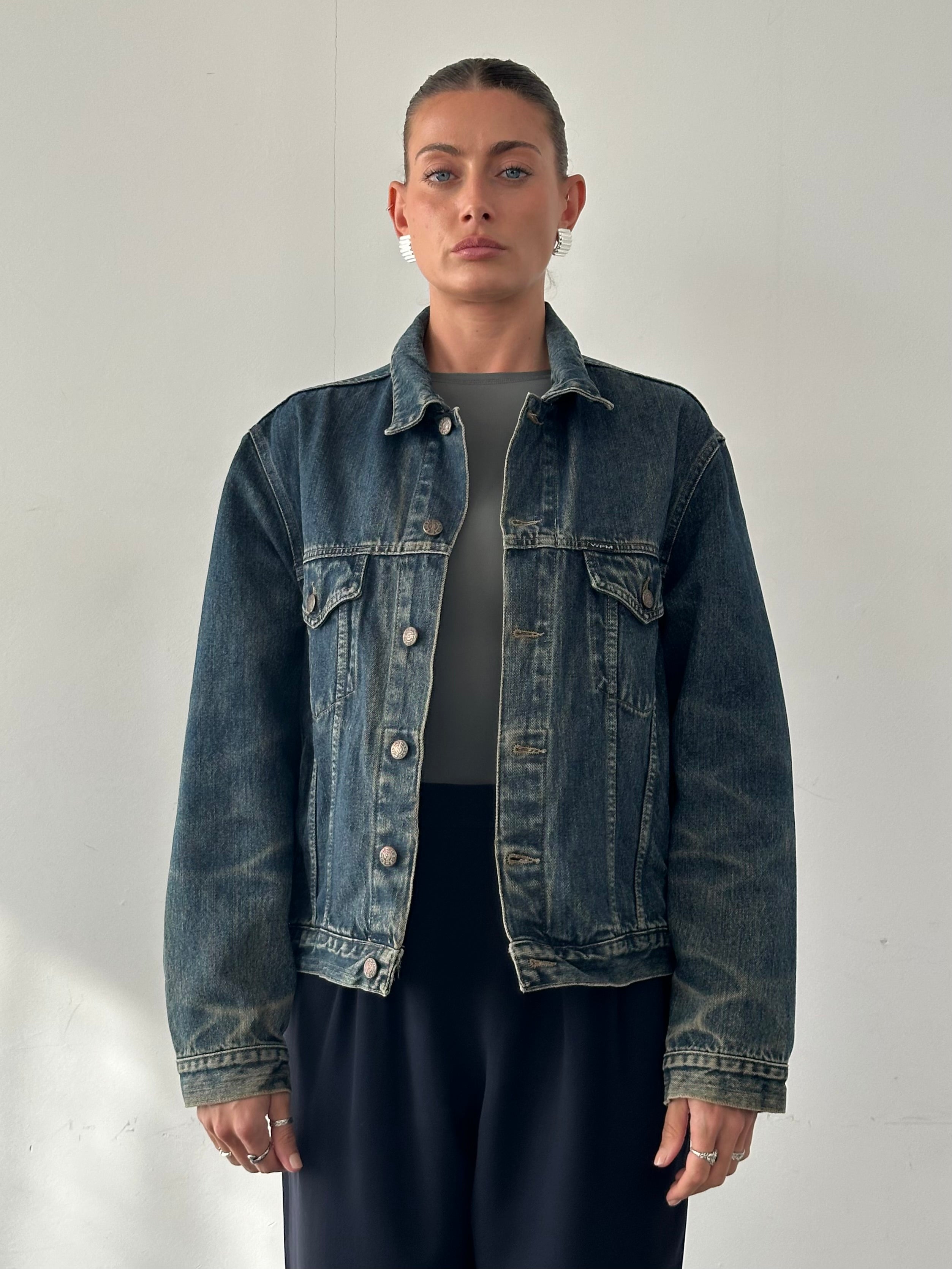 Vintage Italian washed denim jacket in size M/L, featuring classic distressed denim style and vintage-inspired design.