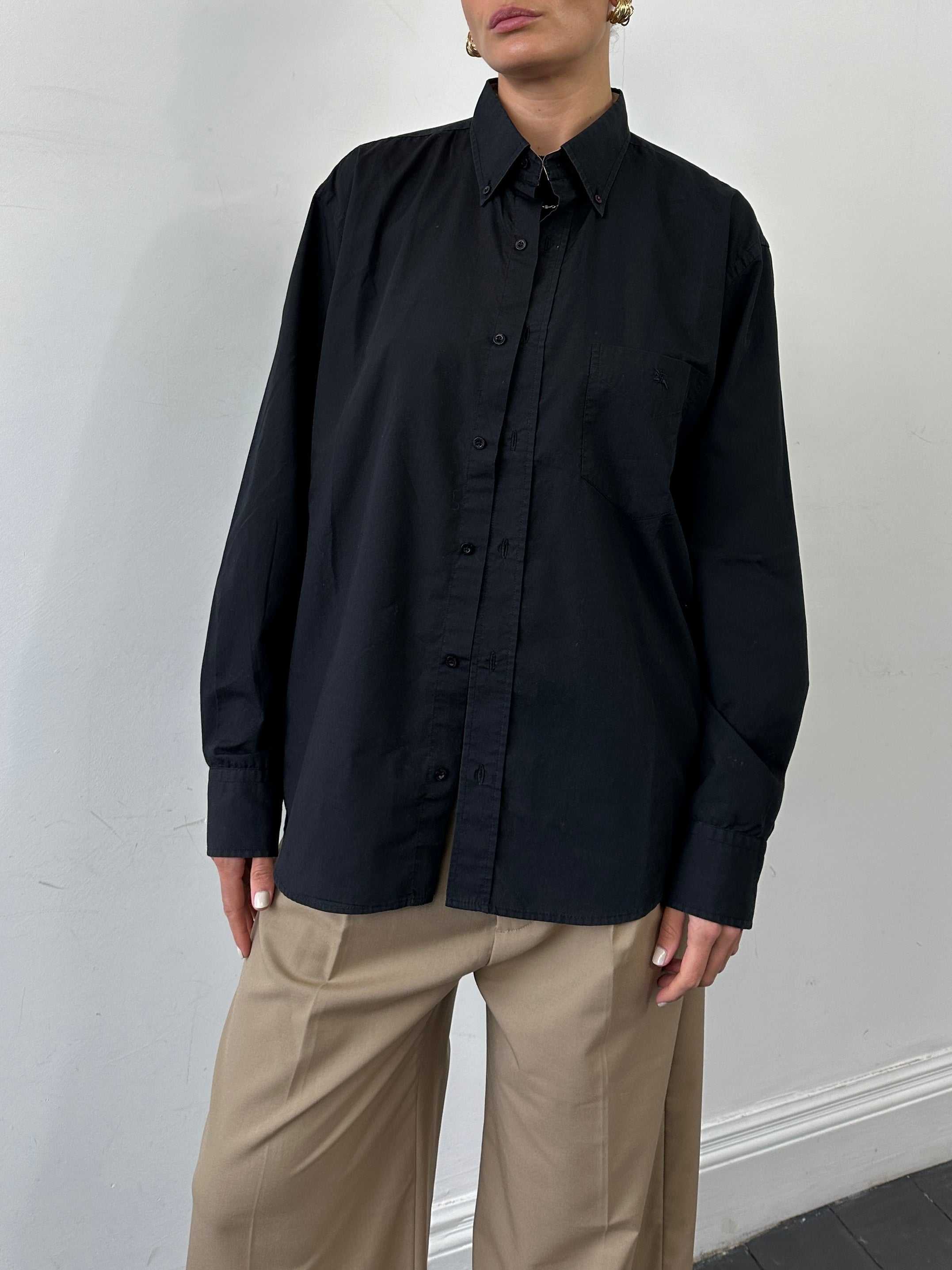 Burberry London pure cotton logo shirt in XL displayed on a hanger, featuring classic design and signature branding.