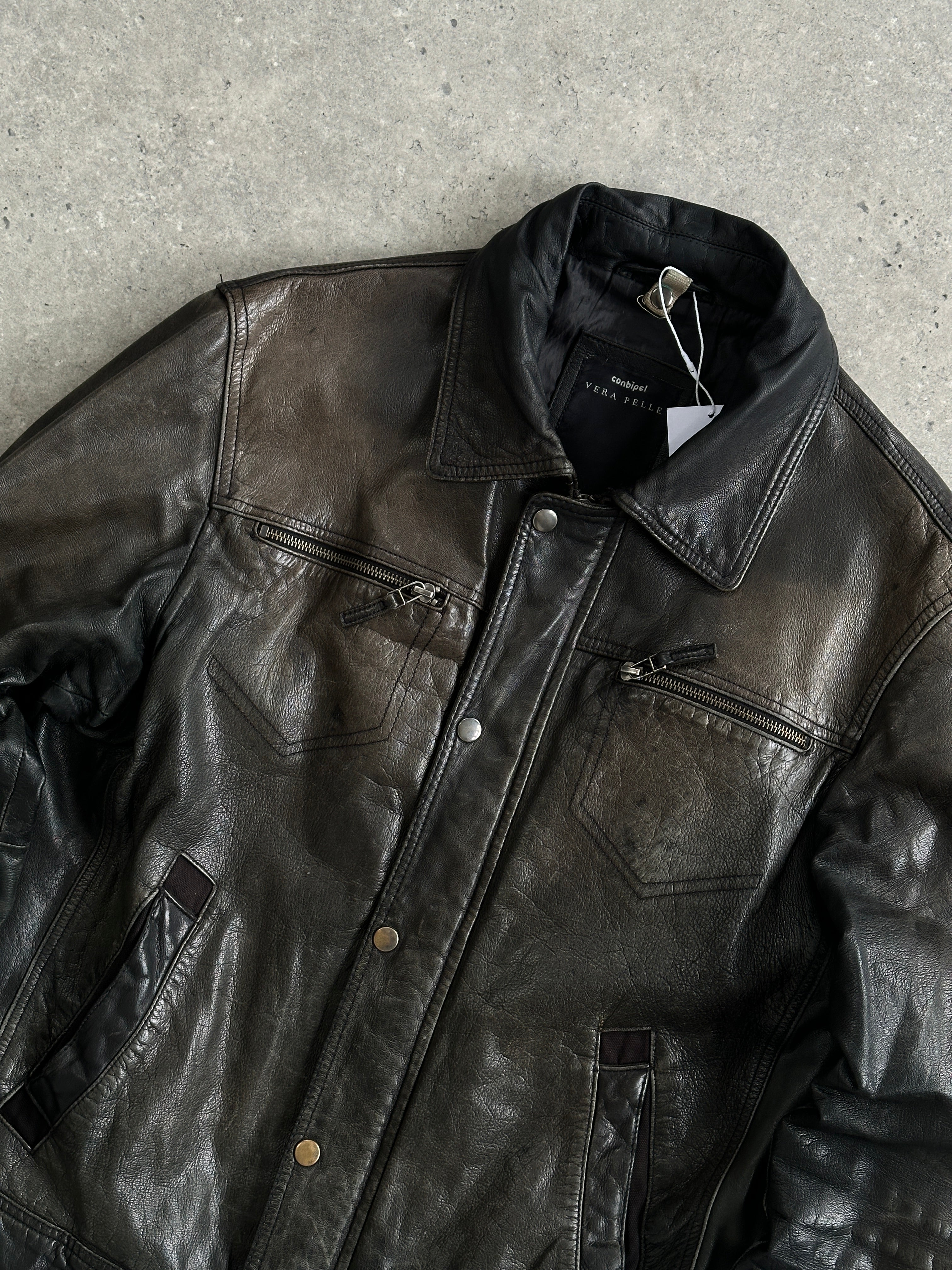 Conbipel distressed leather jacket in size M, showcasing a rugged style with worn-in leather and classic jacket design.