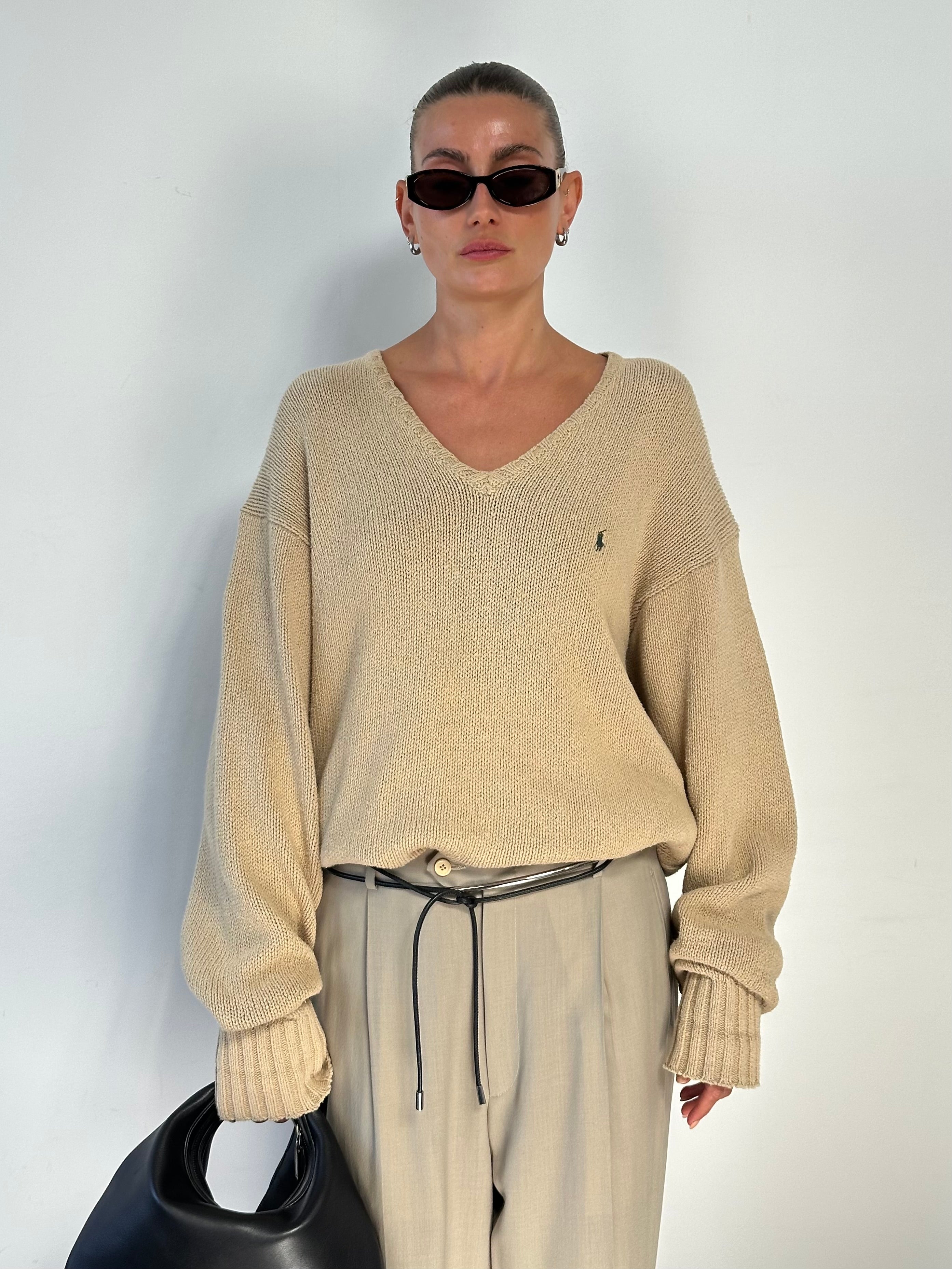 Ralph Lauren Polo Pure Cotton knitted logo jumper in XL, featuring a classic design and Ralph Lauren branding, displayed on a hanger.