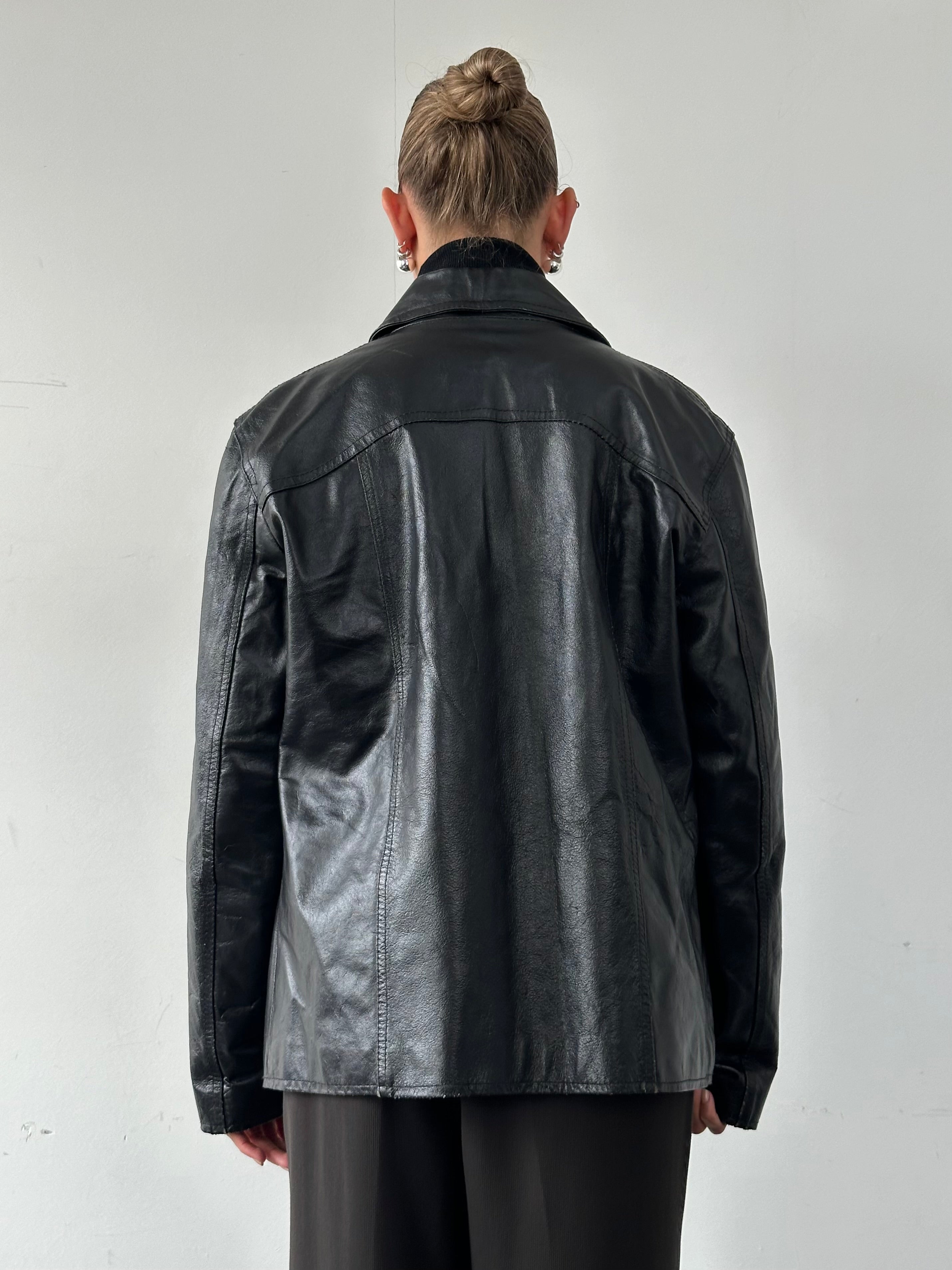 Vintage Italian vintage leather jacket with dagger collar, size large, stylish and rugged men's leather outerwear.