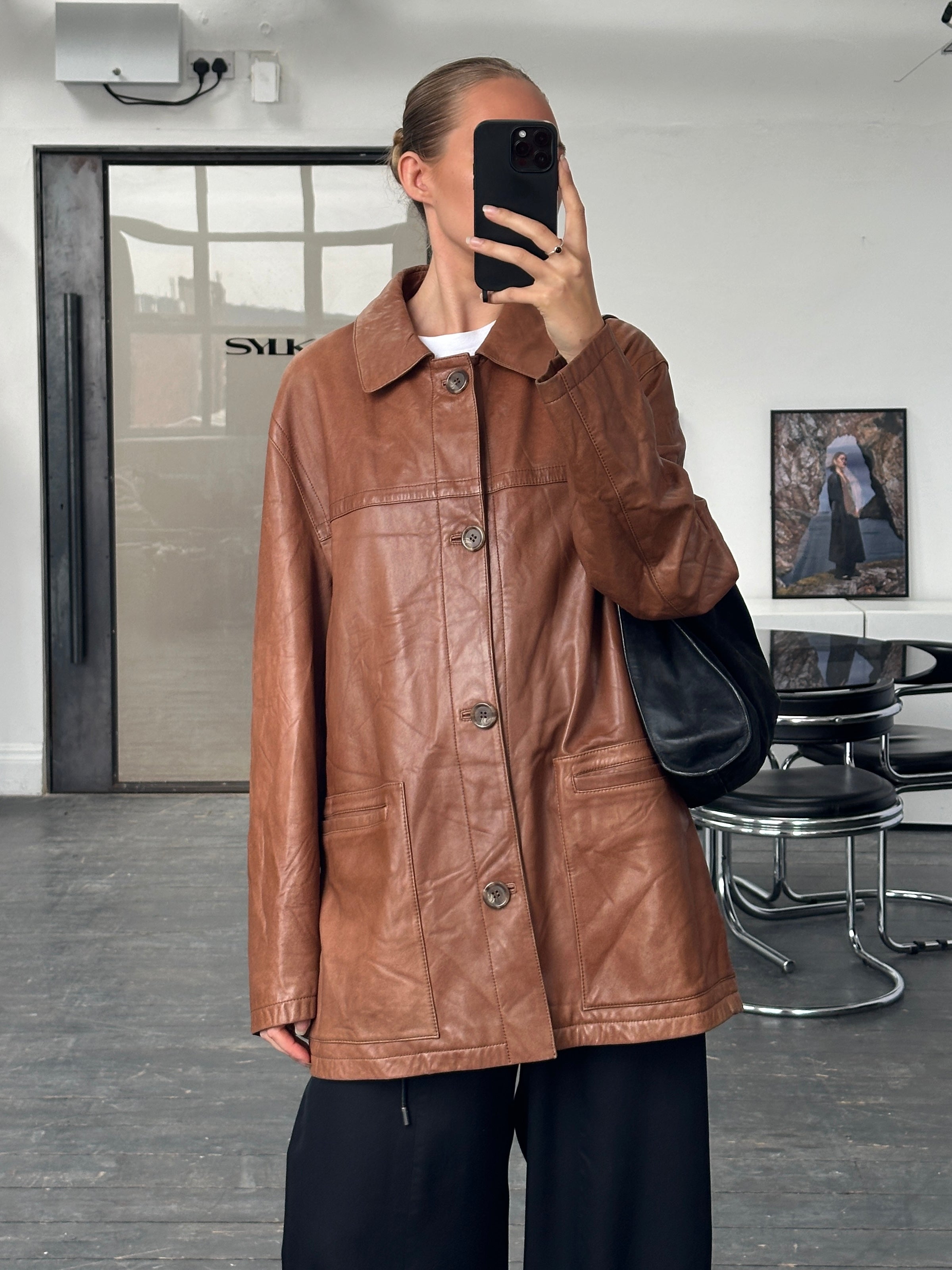 Burberry London 2000s aged smooth leather jacket in XL, featuring classic design and rich texture, displayed on a hanger.