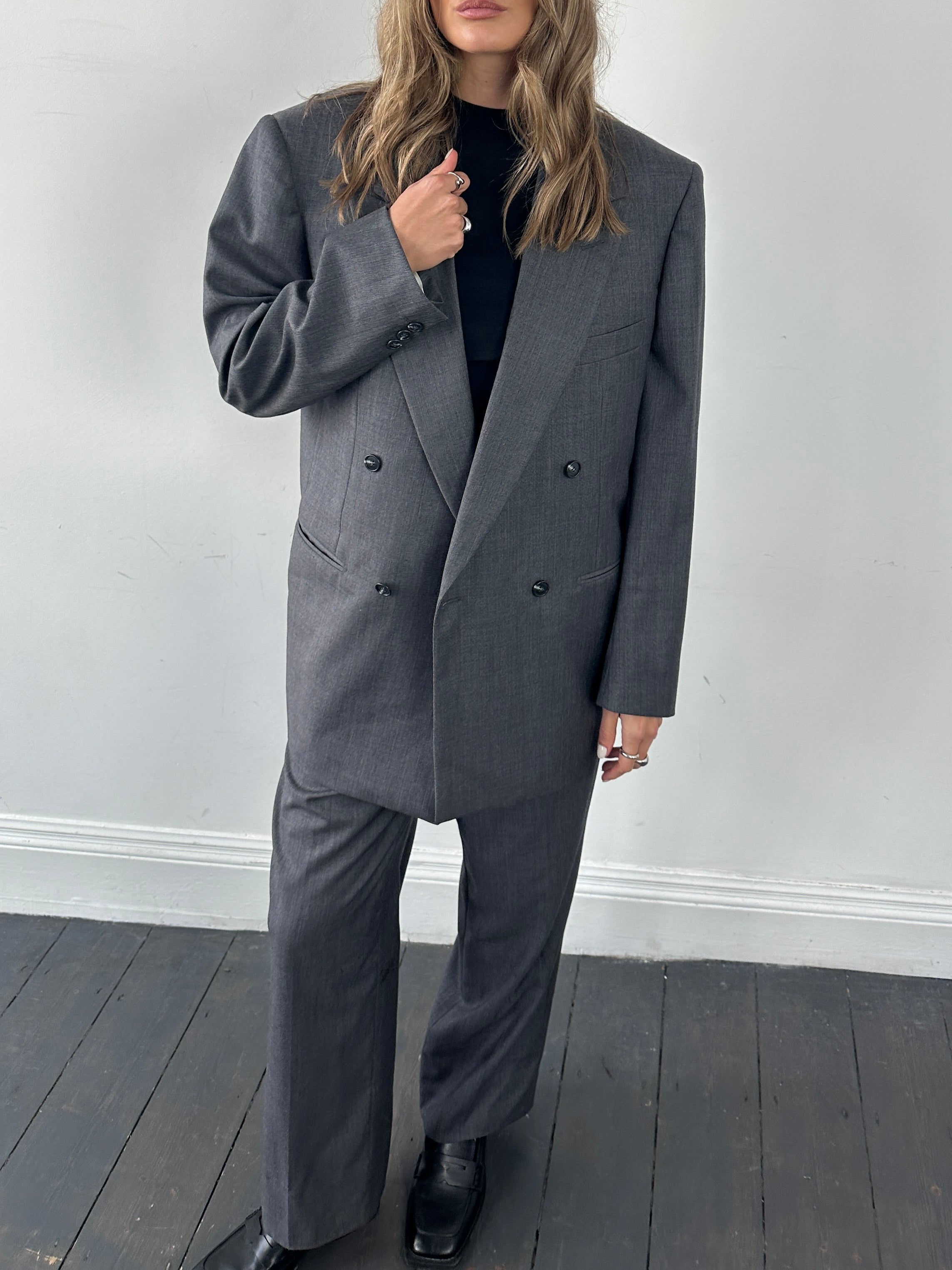 Christian Dior wool double-breasted jumpsuit in size 44S/W34, tailored fit with lapel collar and button details, full-length view.