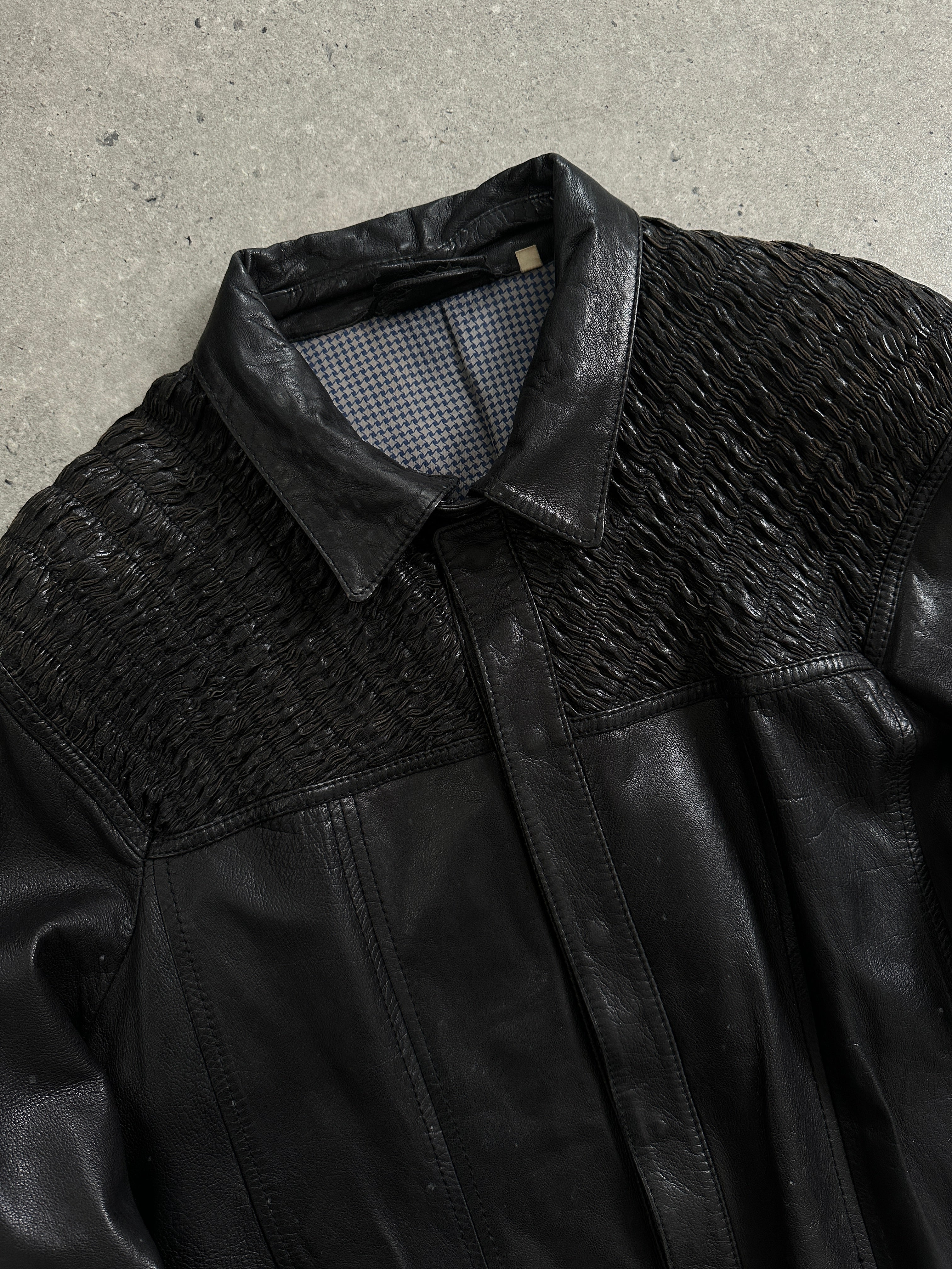 Vintage brand vintage ruched leather jacket in size M, showcasing classic design with textured leather and stylish ruched details.