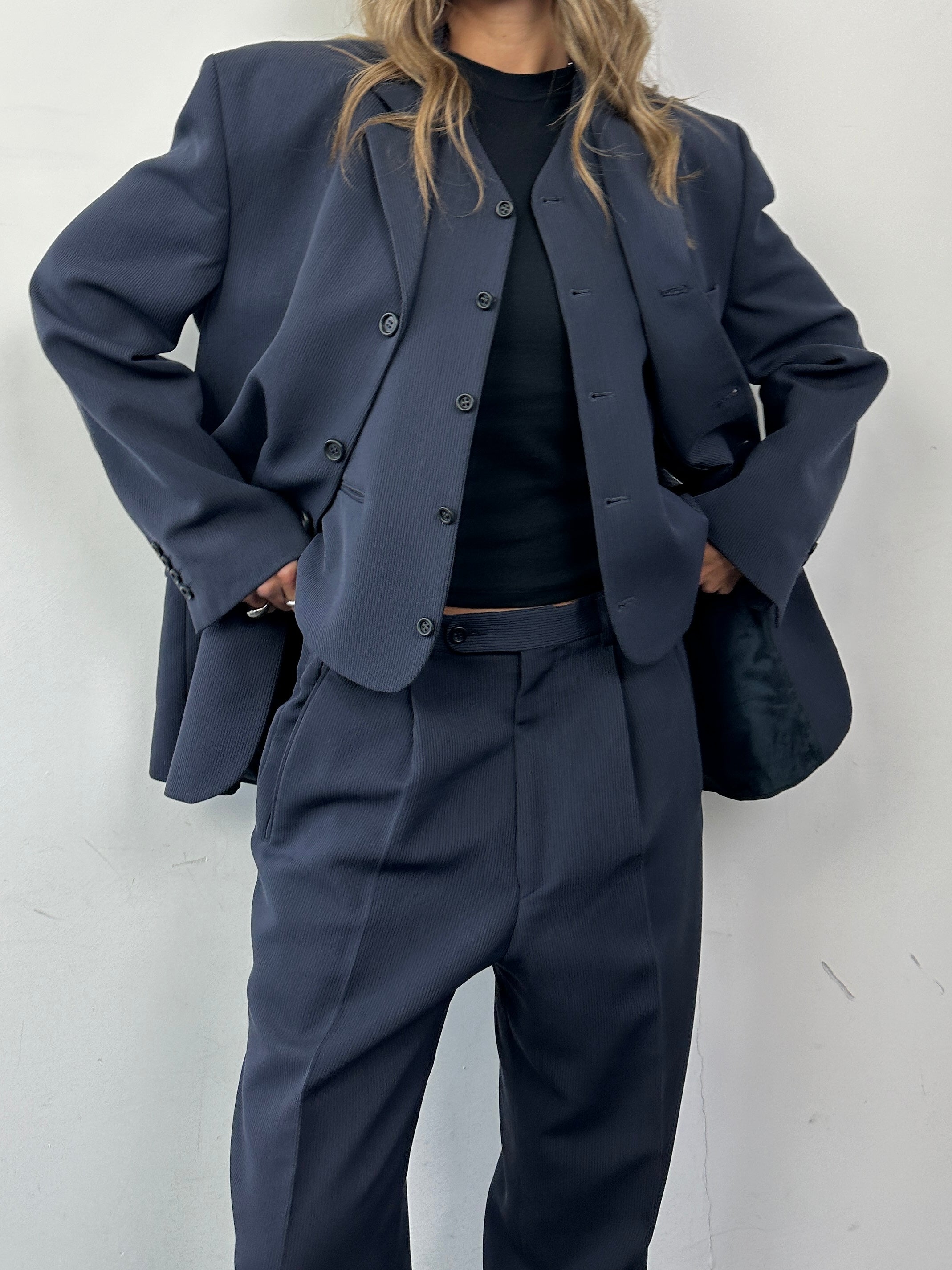 Vintage wool blend three-piece suit in size 40R/W32, featuring tailored jacket, vest, and trousers with classic style.