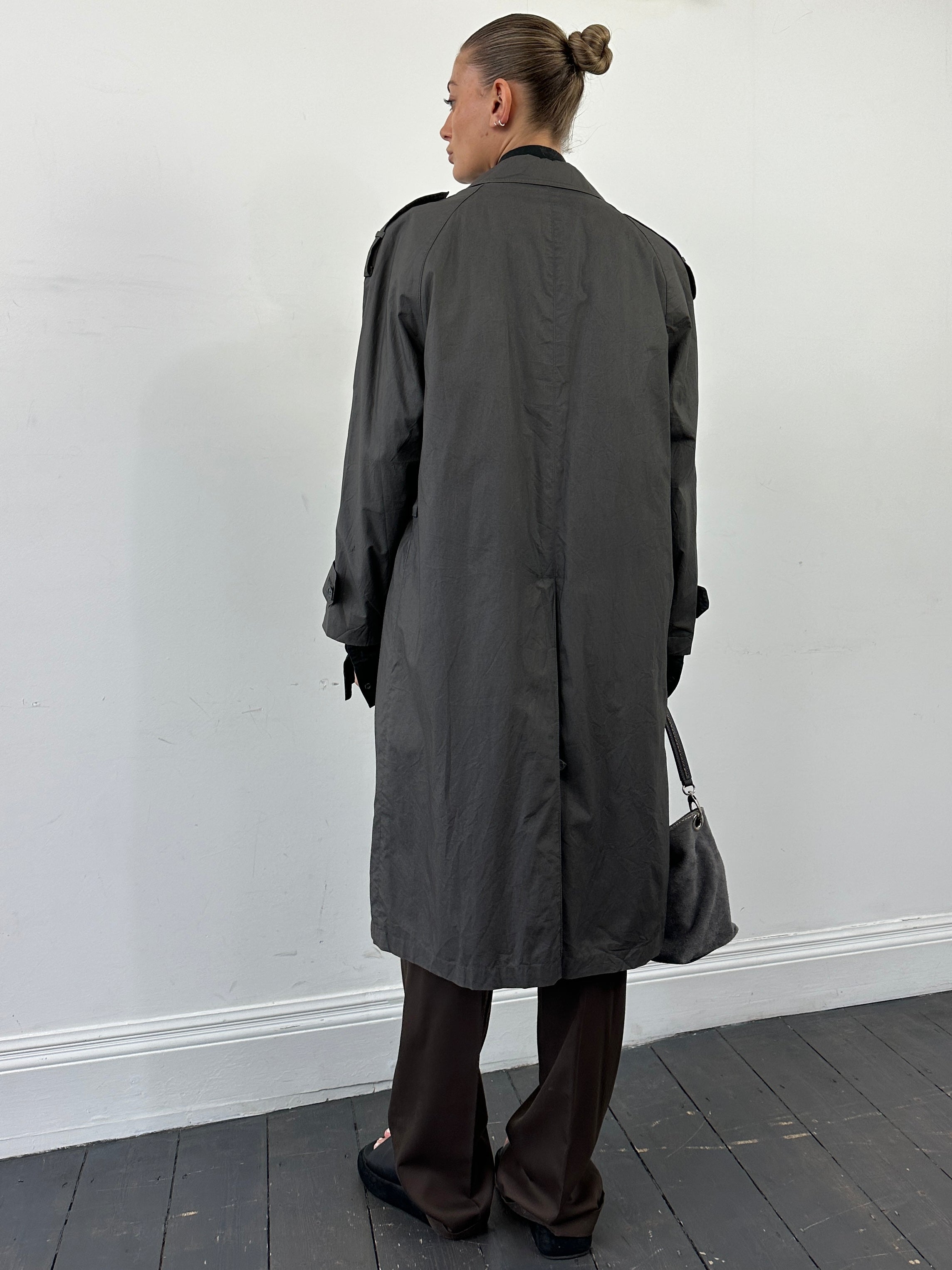Yves Saint Laurent Pour Homme cotton trench coat with concealed placket, in M/L size, shown hanging on a hanger.