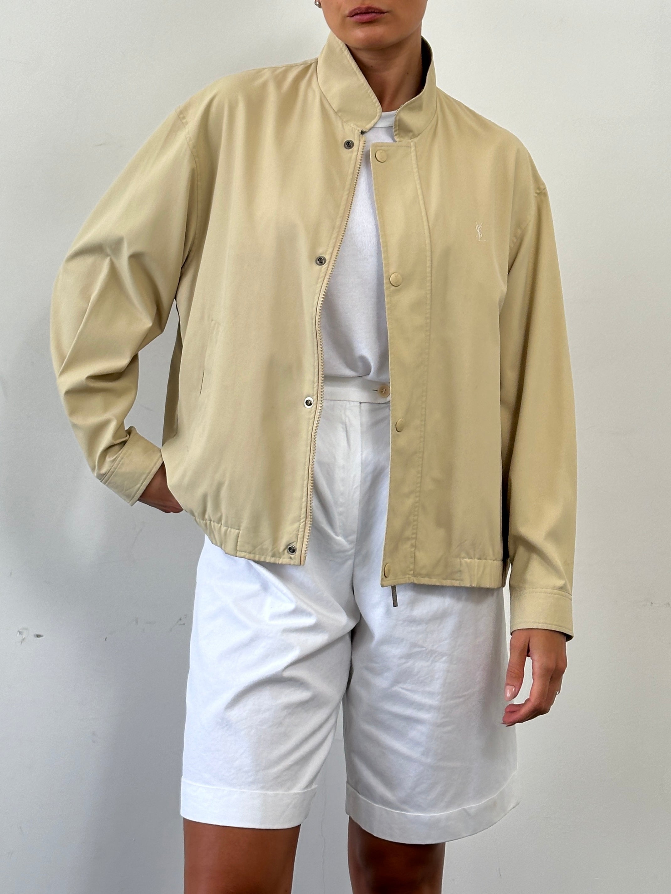 Yves Saint Laurent Pour Homme logo bomber jacket in black, front view showing brand logo on chest and classic bomber style.