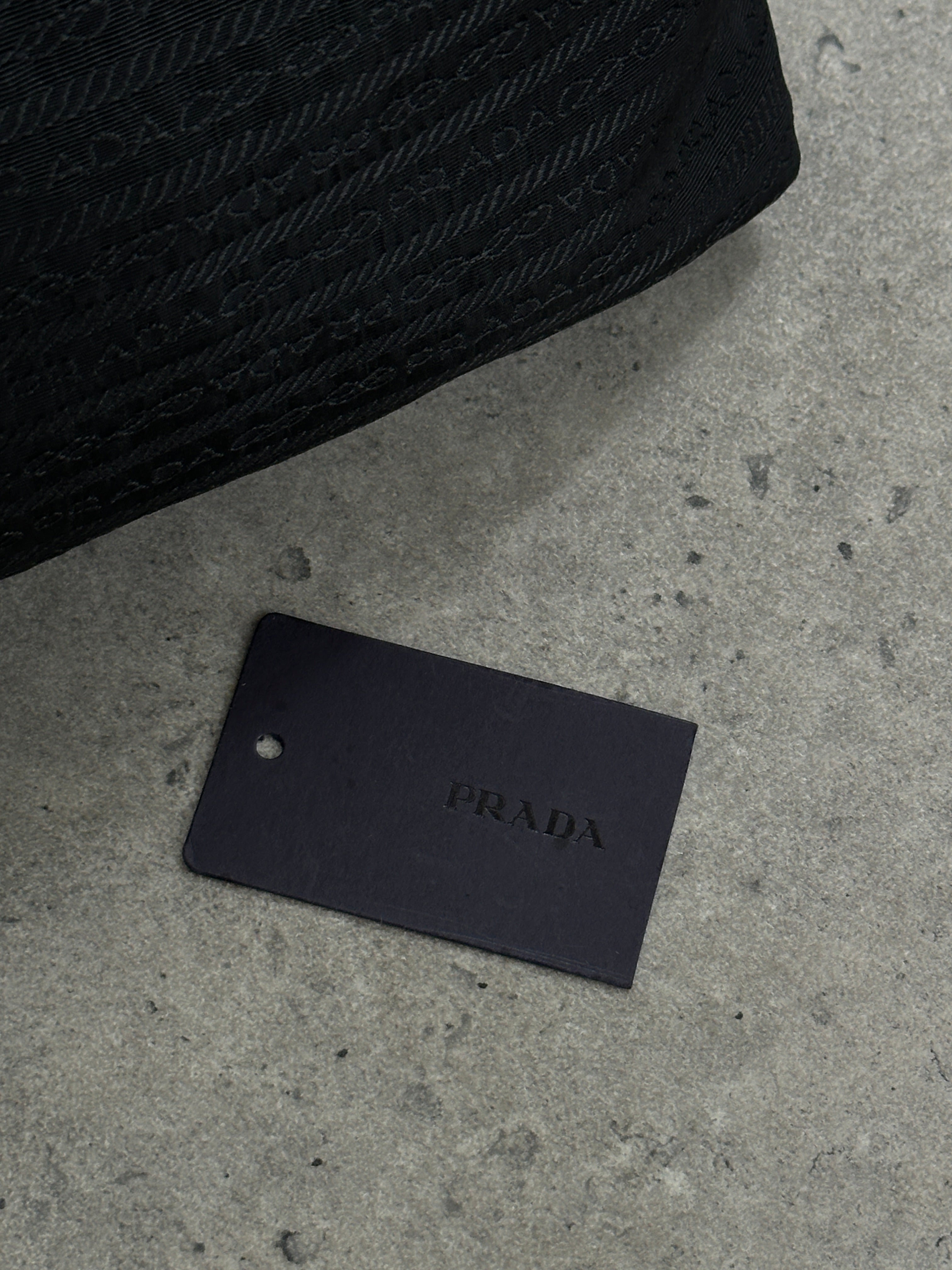 Prada Nylon Tessuto Monogram Crossbody Bag with adjustable strap and signature logo print, lightweight and stylish for everyday use.