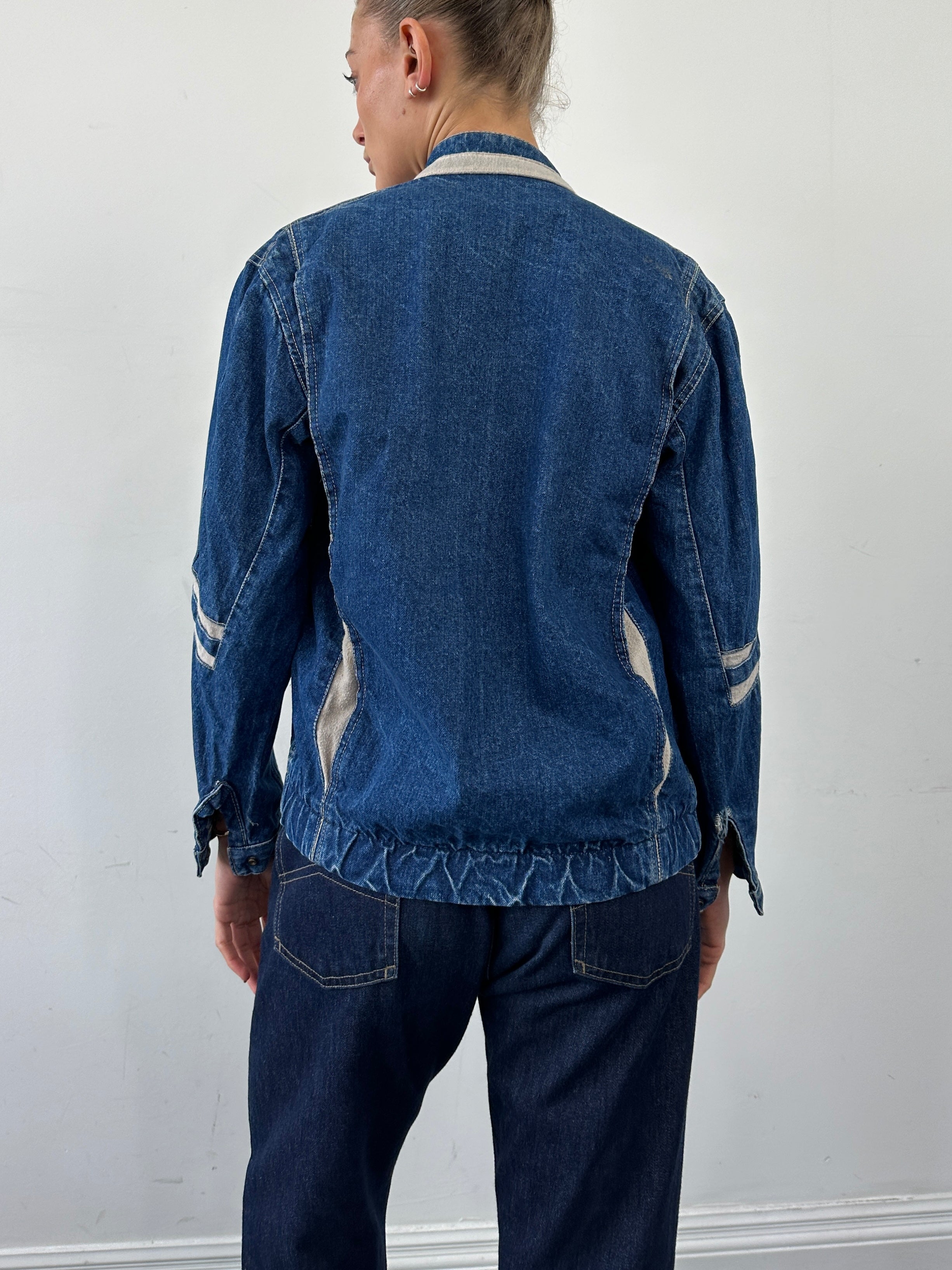 Vintage contrast stitch denim jacket in size small/medium, featuring classic design and durable denim fabric.