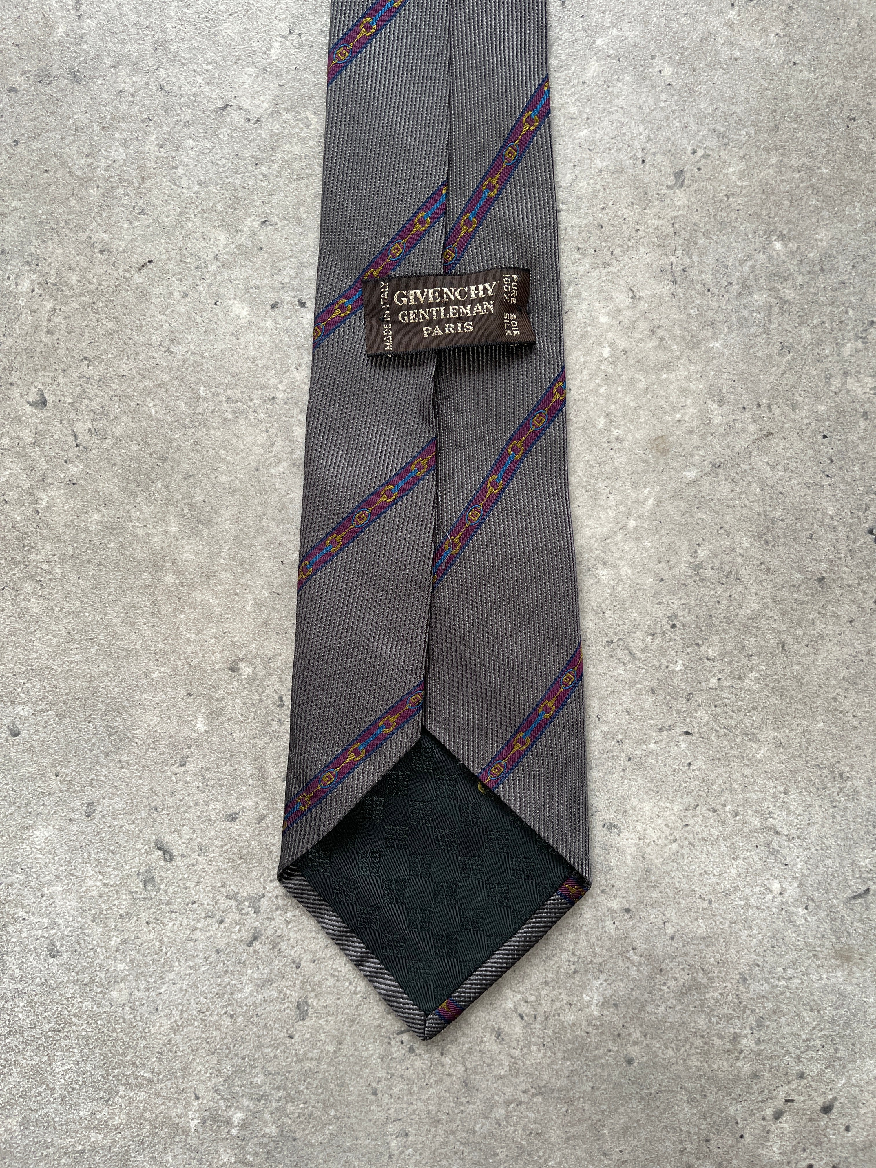Givenchy 1990s pure silk diagonal stripe tie with navy, red, and white pattern, showcasing elegant craftsmanship and classic style.
