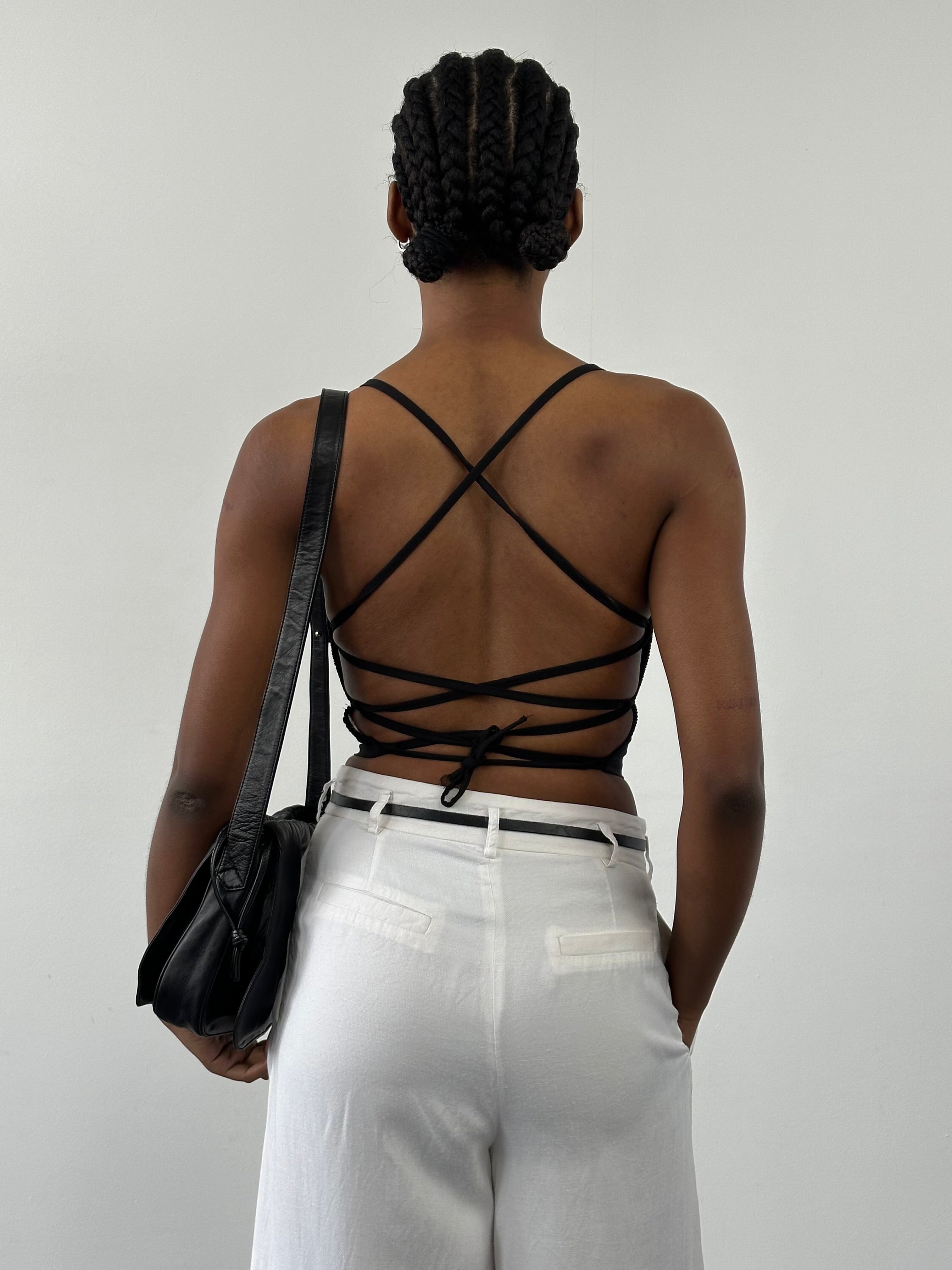 Vintage 2000s viscose crop top with back strap, cropped style, in black, featuring a fitted silhouette and vintage-inspired design.
