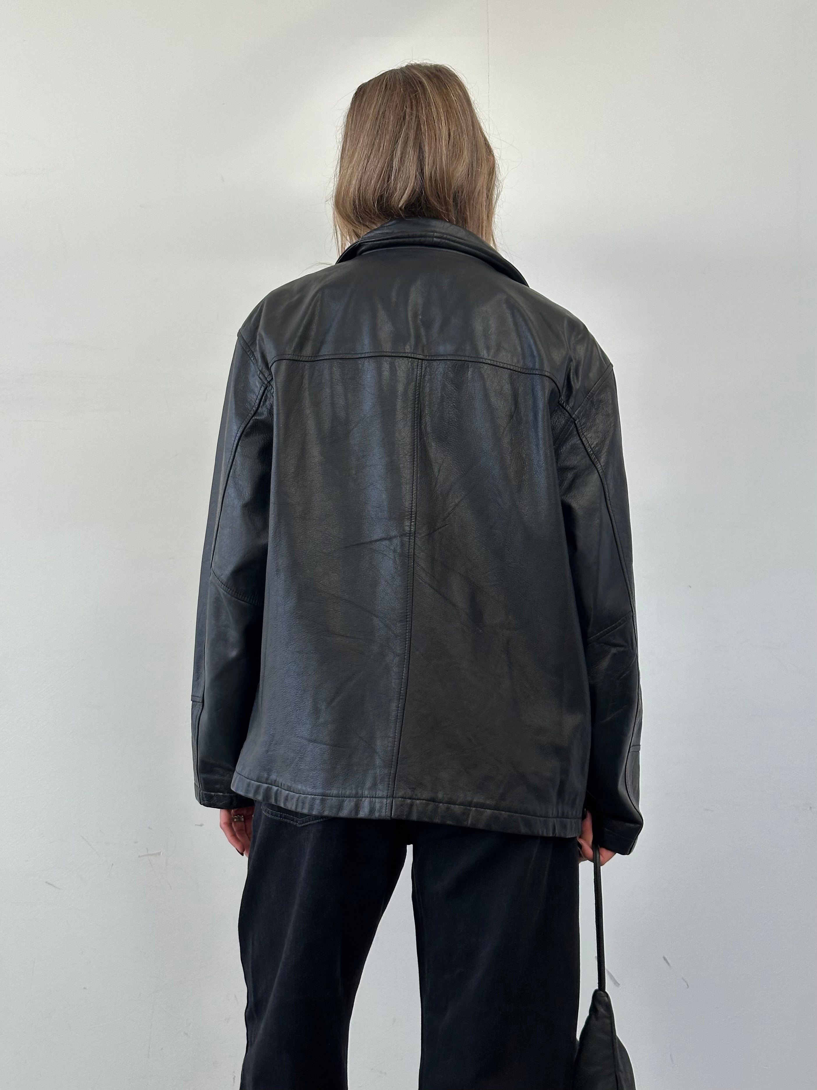 Vintage leather bomber jacket in XL size, featuring classic design and authentic leather texture, perfect for vintage style enthusiasts.