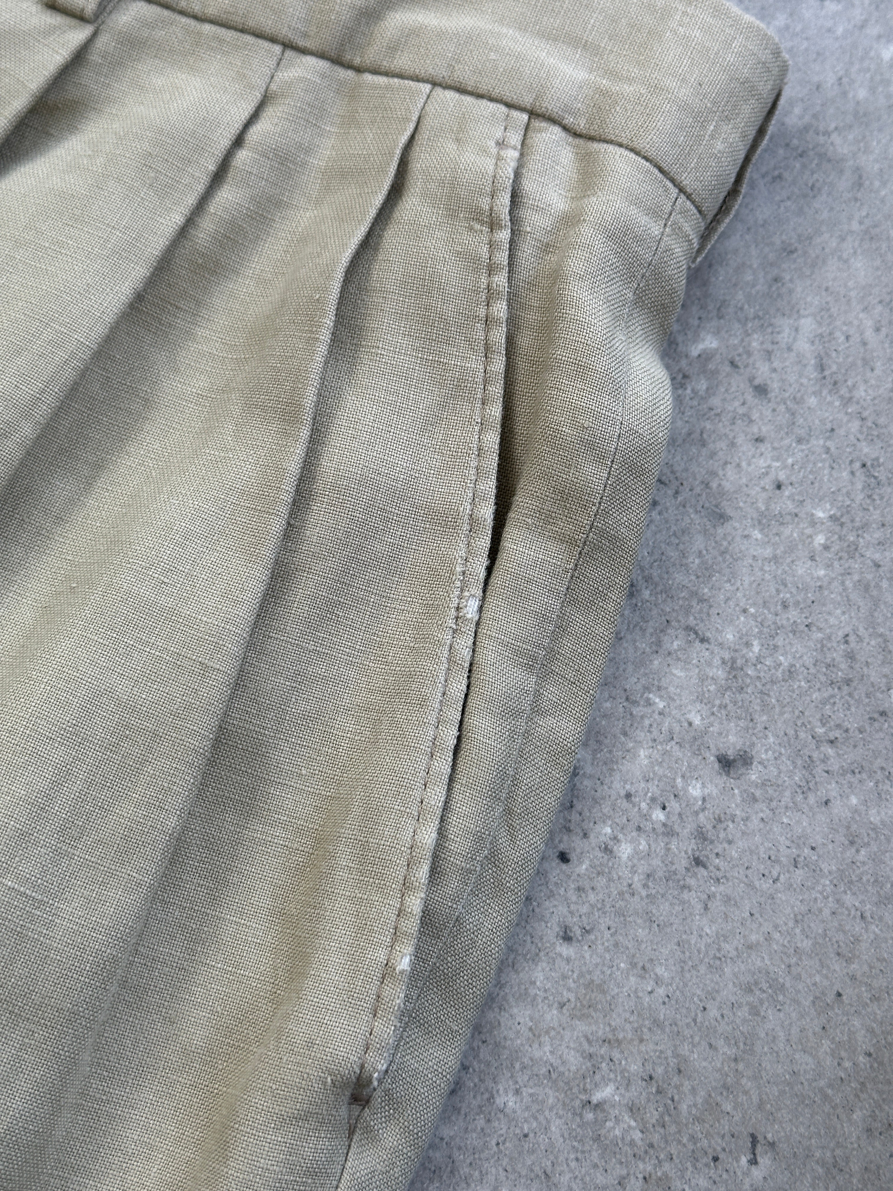 Christian Dior Monsieur pure linen single-breasted jumpsuit in size 42S/W32, tailored fit, light beige color, visible lapels and buttons.