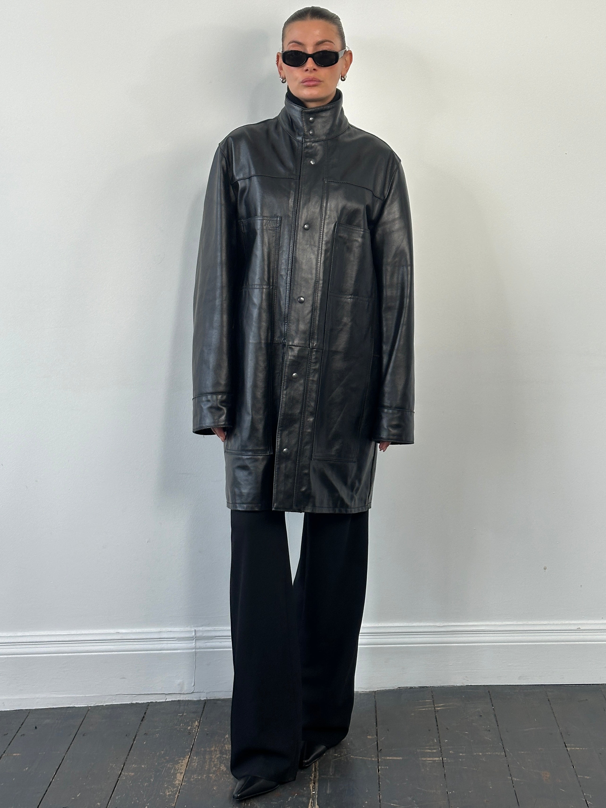 Vintage 1990s Italian leather trench coat with funnel neck, oversized fit, in classic brown leather, stylish vintage leather jacket.