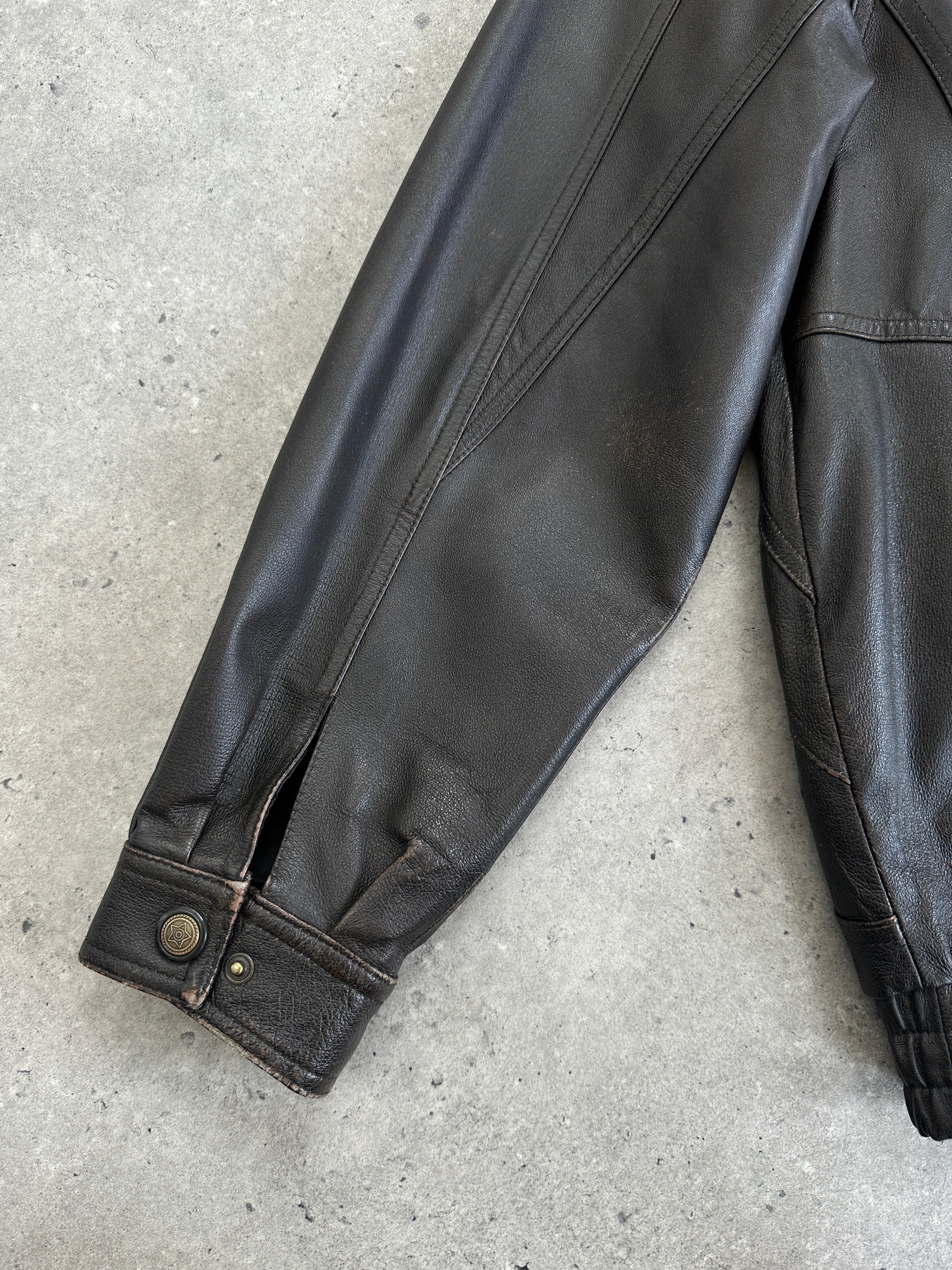Vintage leather blouson bomber jacket in XL with classic style and distressed finish, featuring a ribbed collar and cuffs.