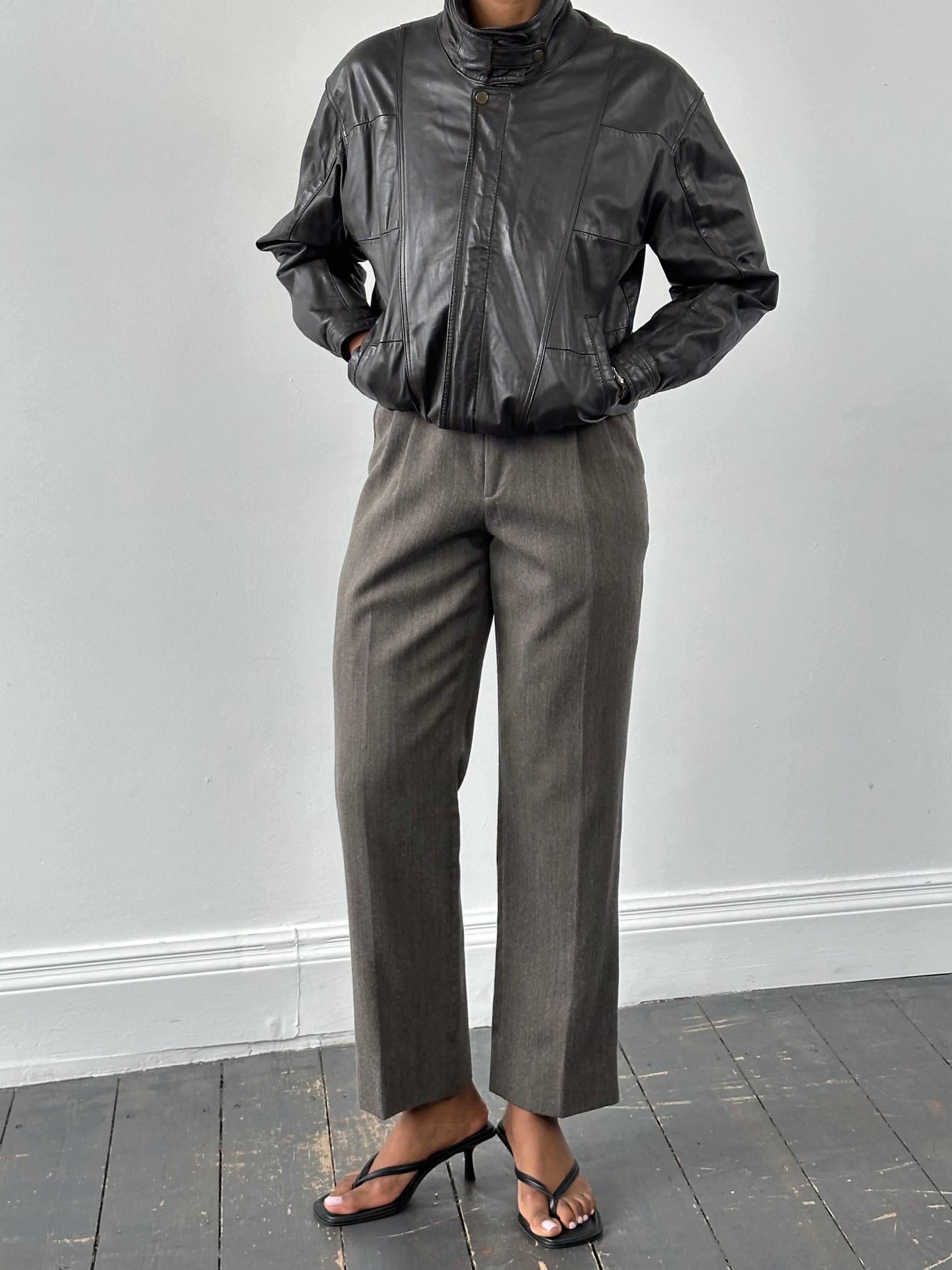 Vintage 1990s pure wool tailored trousers in size W30, featuring classic cut and timeless style.